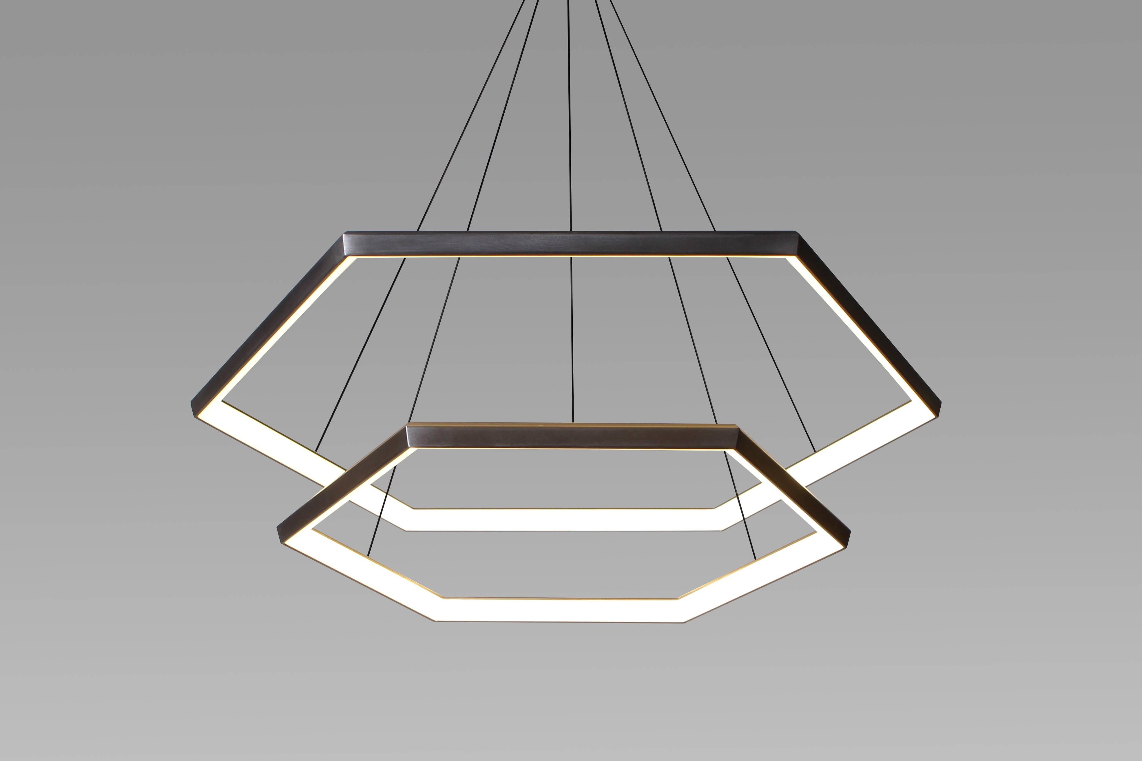 Hexia Cascade HXC46-2 is the beautiful meeting of the hexia line. Suspended effortlessly one above the other, convex hexagonal forms create a sleek and modern chandelier.

Metal finish
Powder-coat finish available in Metallic Brass, Metallic Gold,