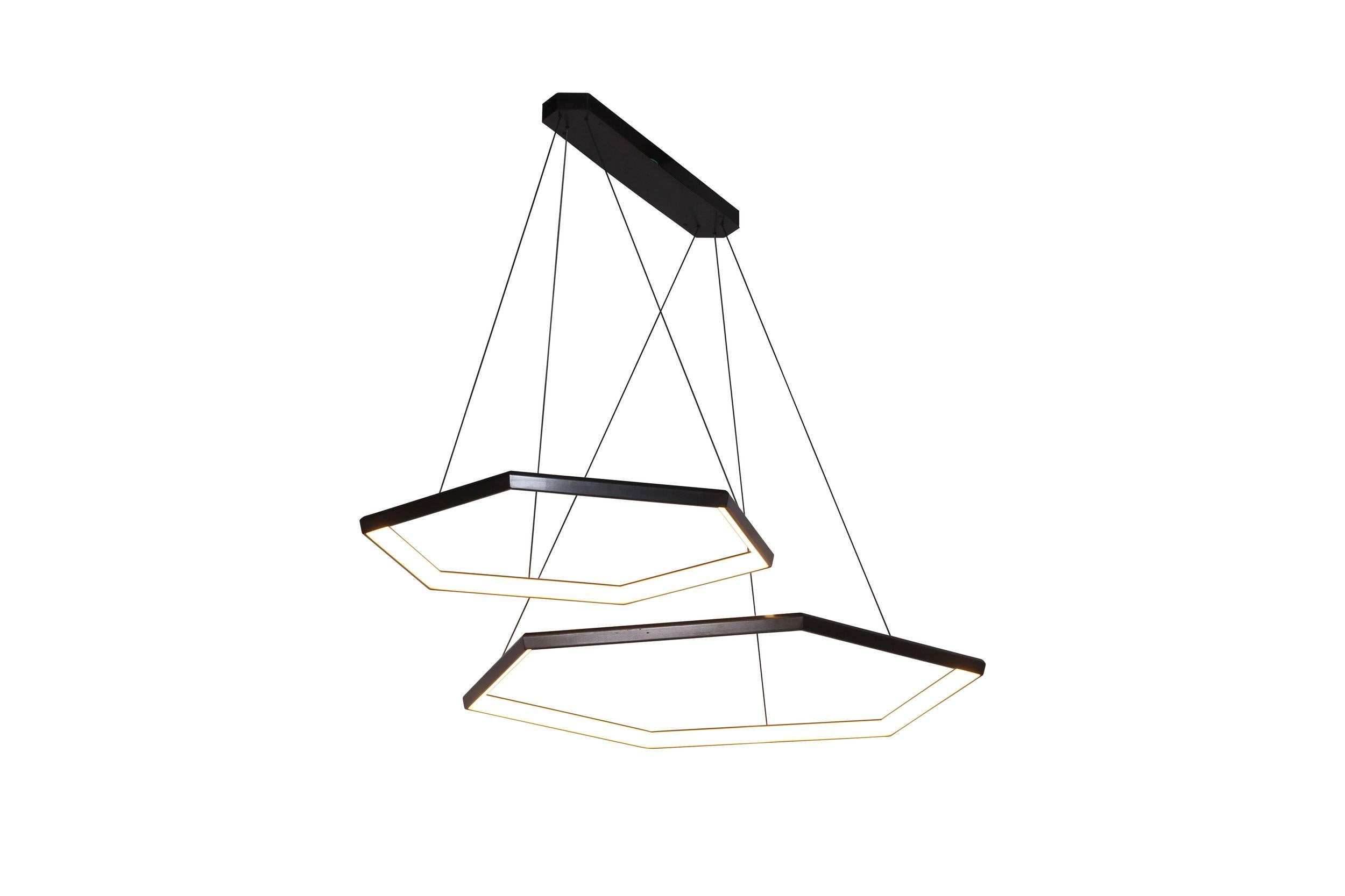 Hexia Duo HXD46 is a linear pairing of two of our HEXIA fixtures. Two rings are suspended from a linear canopy, in an asymmetric arrangement. This fixture can be customized to utilize different sizes. Multiple fixtures can be added to create a