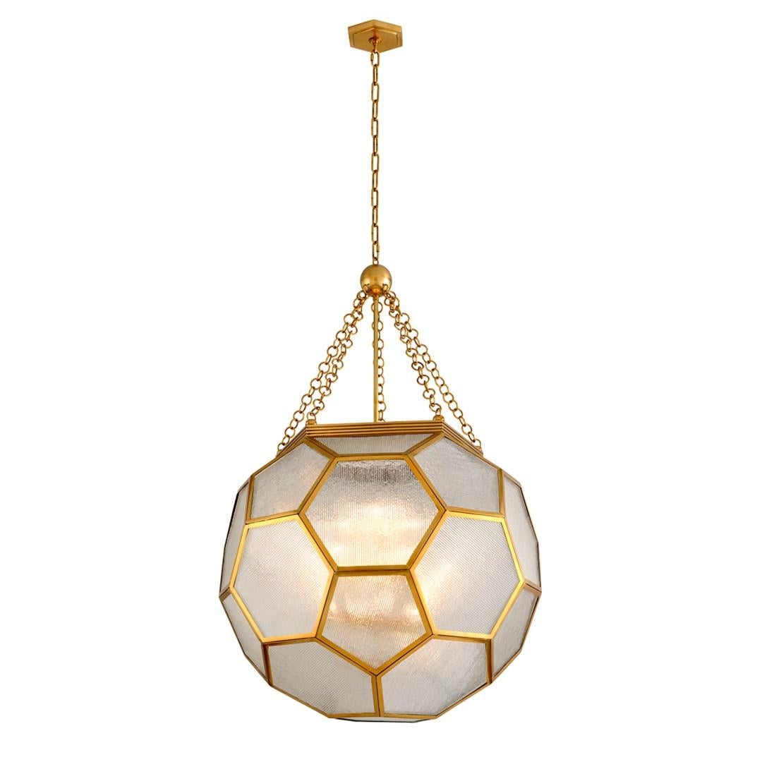 Martyn Lawrence Bullard for Corbett Lighting
Clear glass panels with a ribbed texture maximize light diffusion, and their hexagonal shapes are emphasized by the warm Vintage Brass frame.
This modern pendant light has an Art Deco-inspired feel and