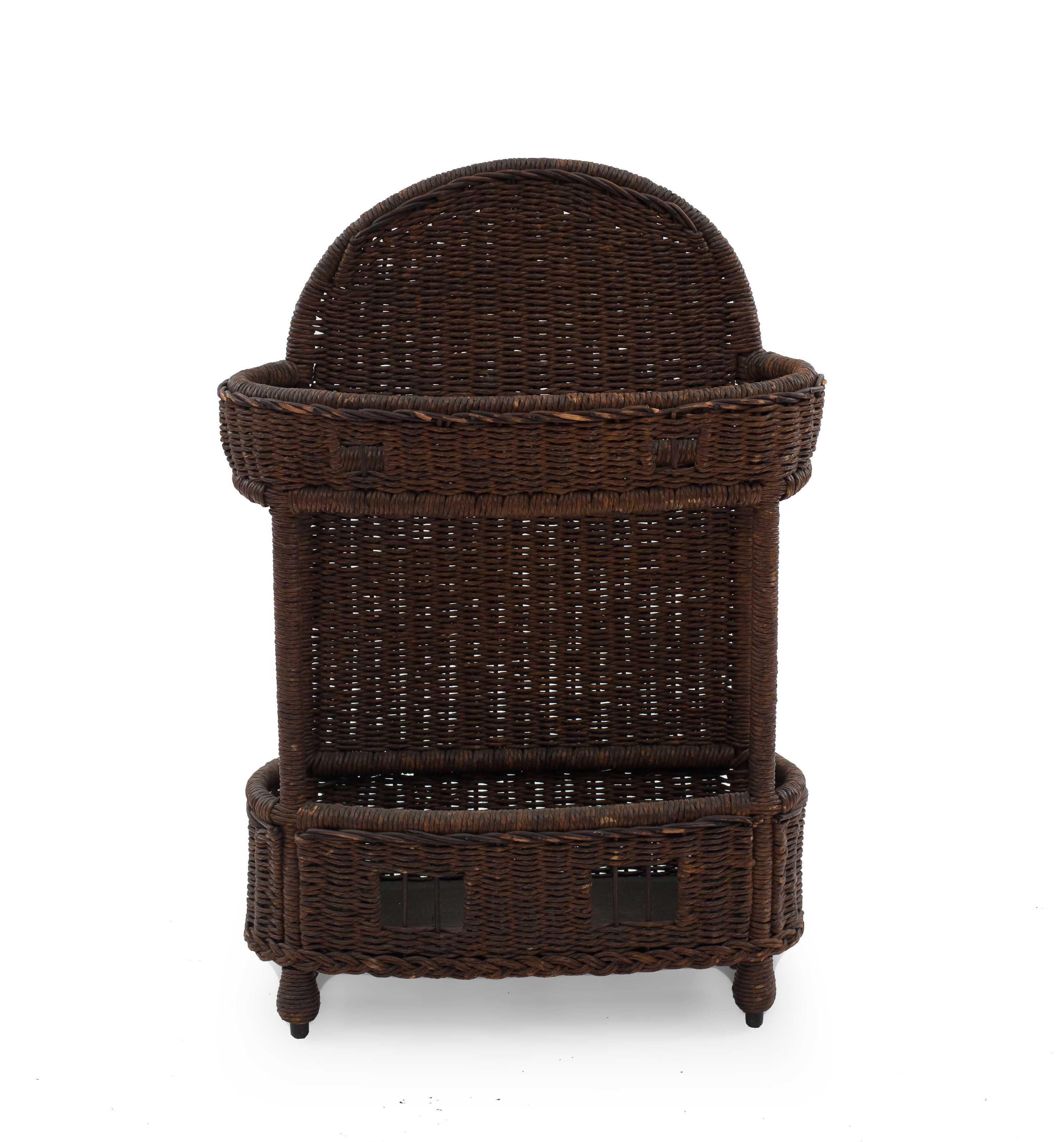 American Victorian natural wicker rectangular umbrella stand with solid woven back and cut out design on front. (HEYWOOD WAKEFIELD label).
 
