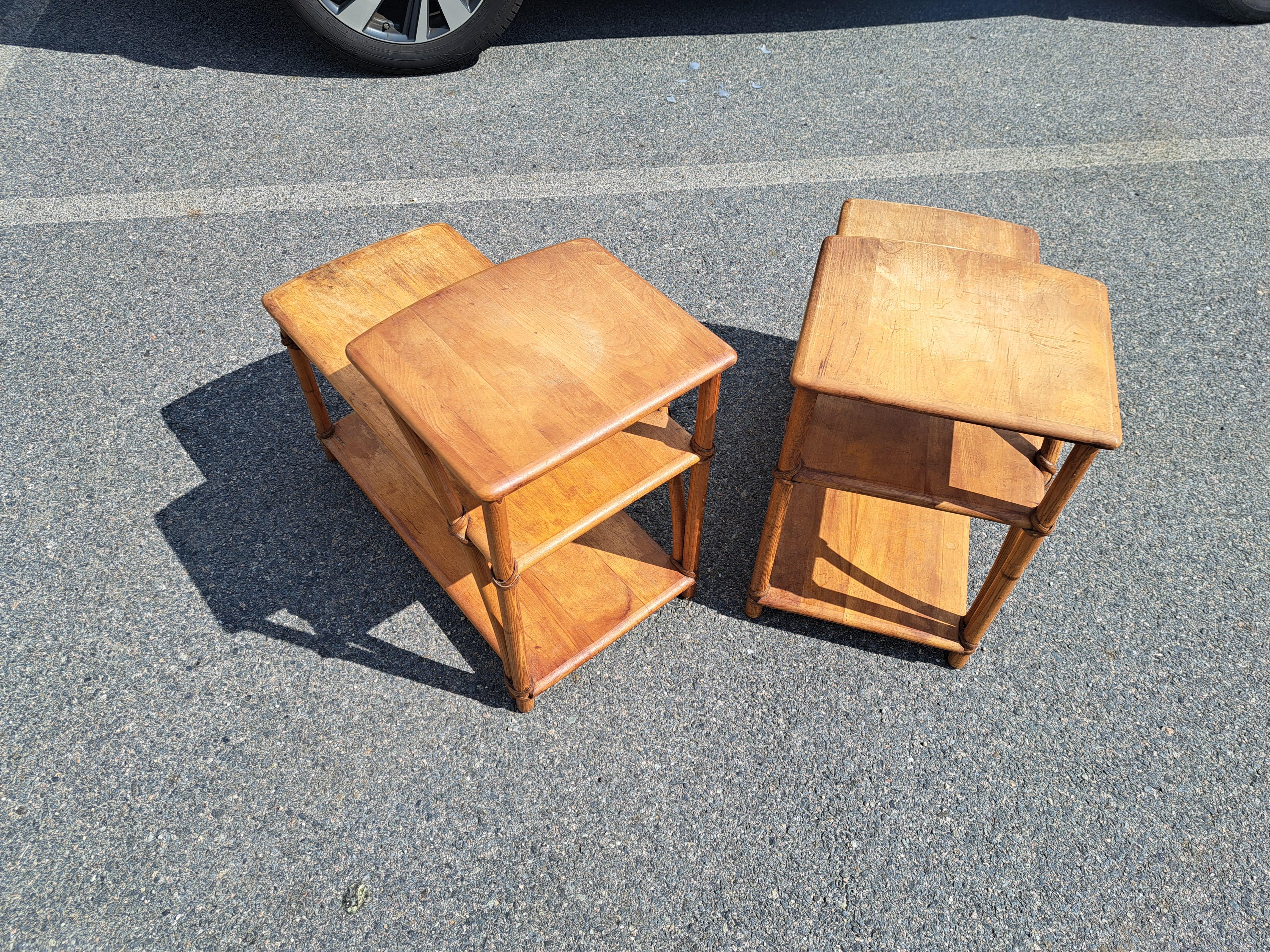 Pair of vintage Heywood Wakefield bamboo step side tables with teak surfaces.  Stamped makers mark on underside.