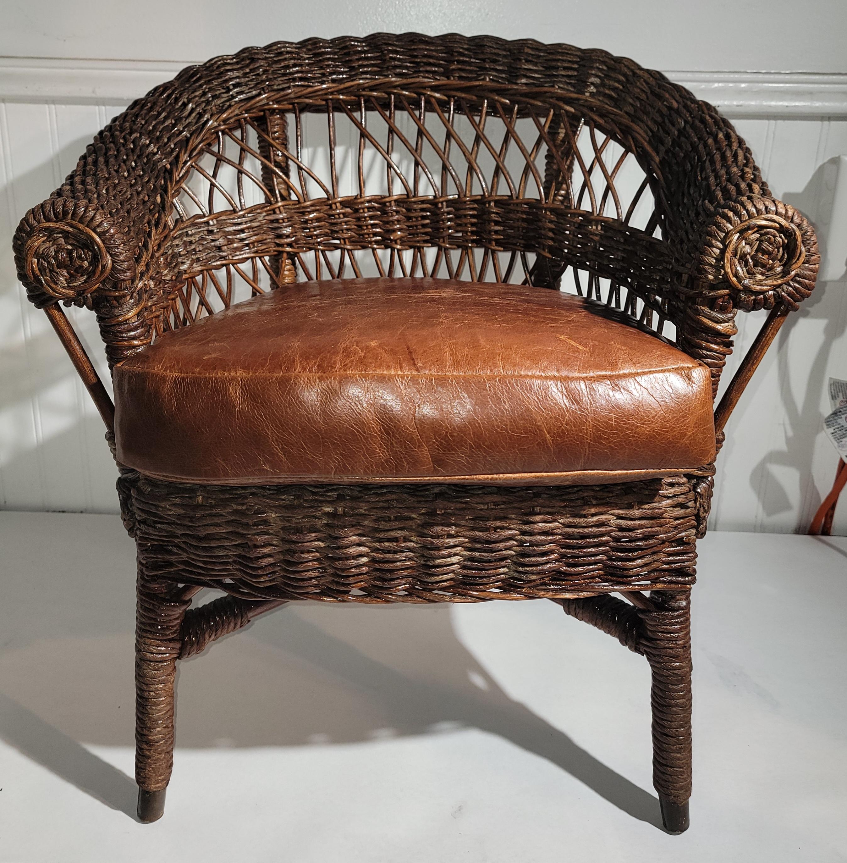 20Thc Heywood Wakefield child's rocking chair with a custom leather cushion in fine condition.Strong & sturdy. This chair has a protective coat of all weather protector.

