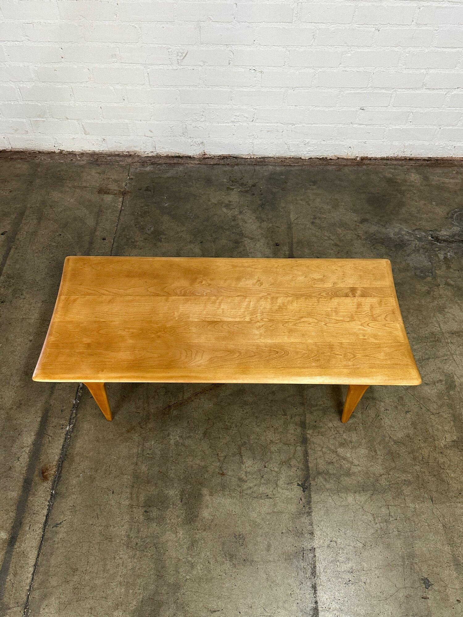 W49.5 D22 H15

Fully restored Heywood coffee table. Item shows well with no major area of wear. Item features solid wooden construction with nice sculptural lines. 