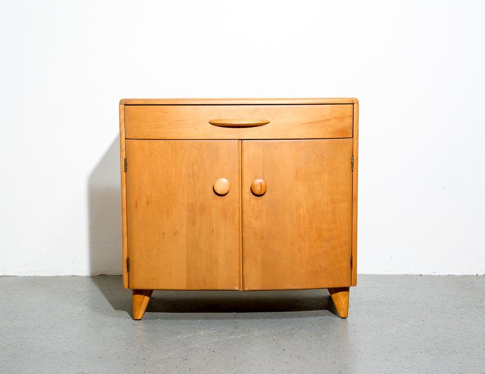 Heywood Wakefield cabinet or nightstand from the 'Crescendo' series. Deco-inspired stylings with bowed front.