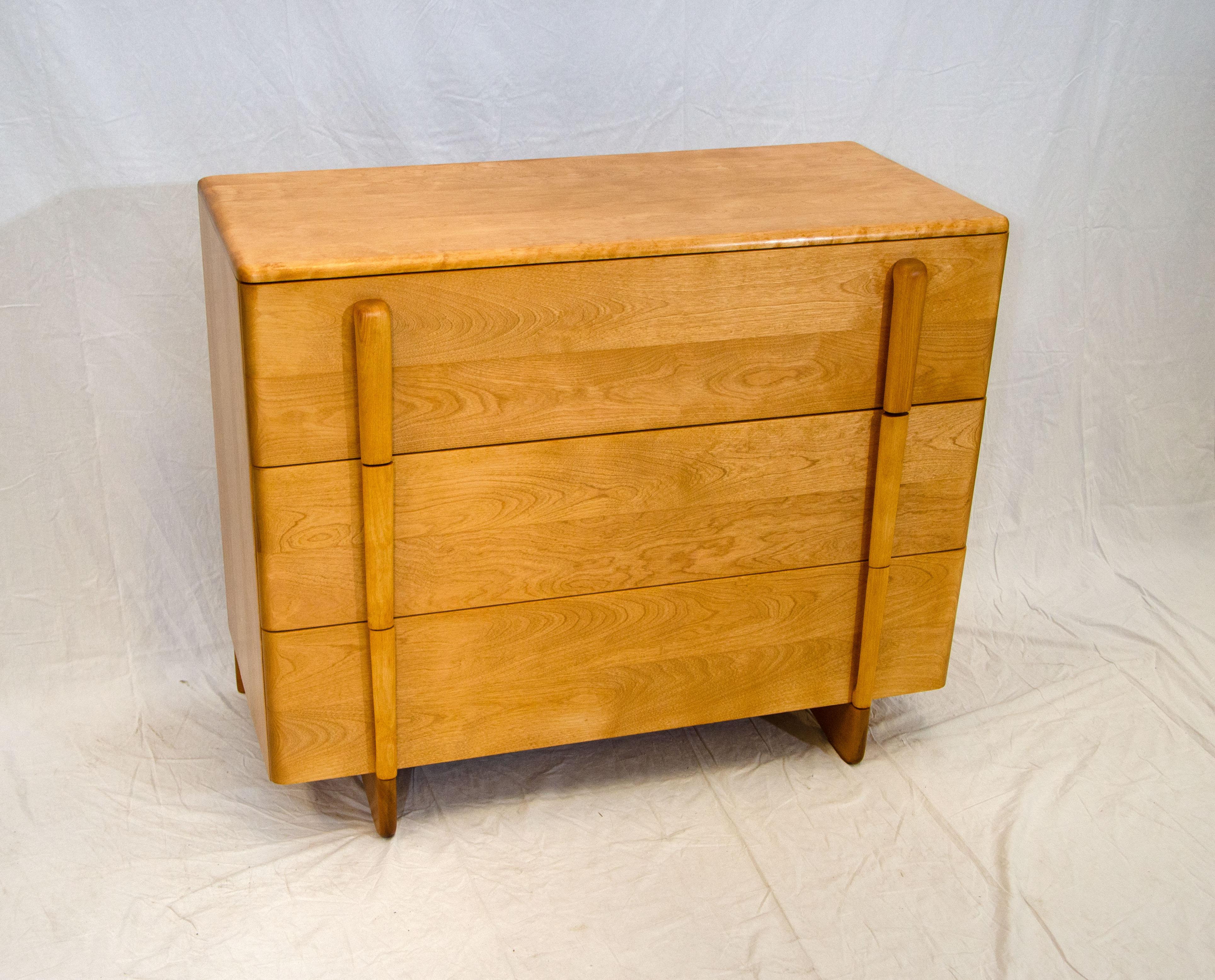 Hard to find a Heywood Wakefield Skyliner dresser/chest with vertically aligned handles and unusual feet to give it a floating appearance. The three large drawers are 8