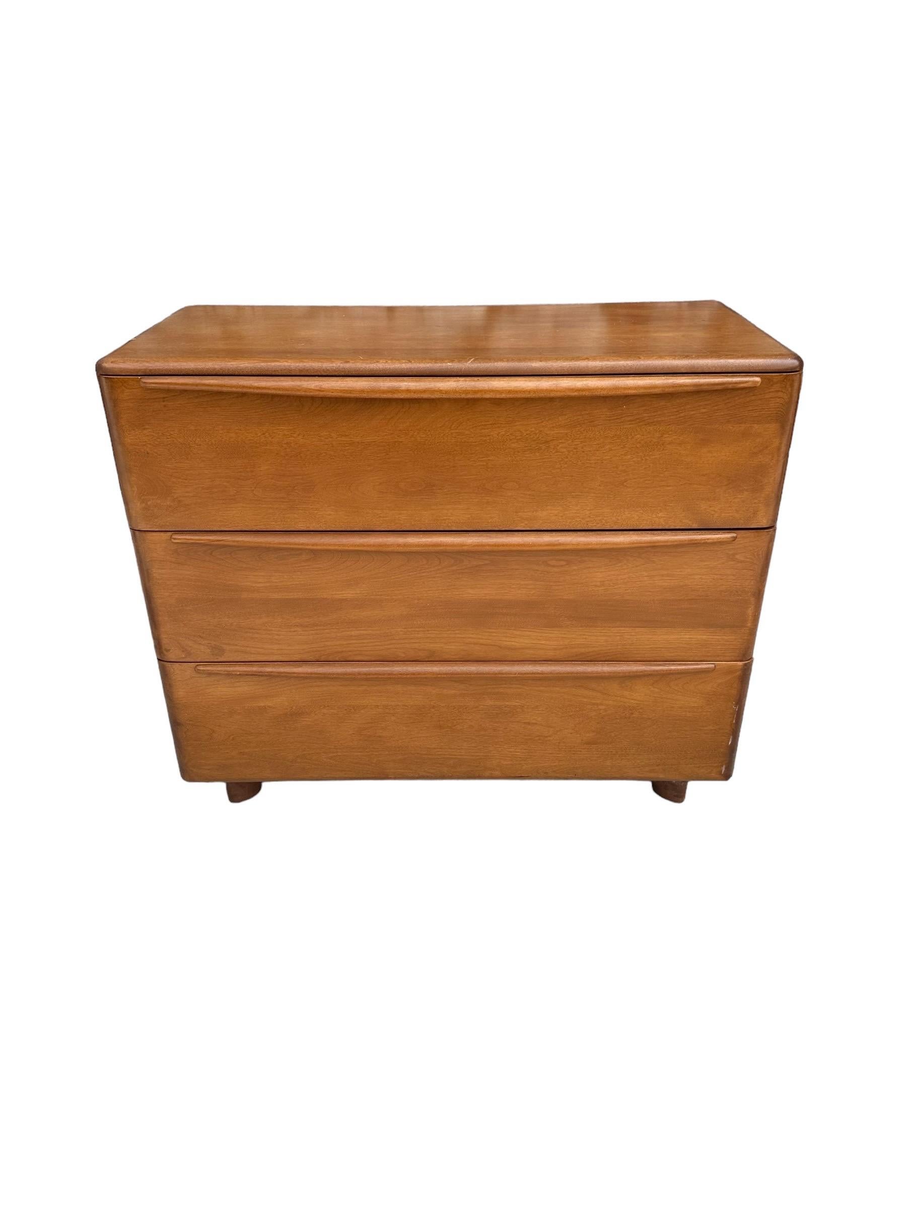 Elegant dresser in original Champagne finish with gorgeous warm patina. Produced by Heywood Furniture Co. sculpted legs, rounded edges, attractive but not dominating maple grains, and 3 fully functioning drawers with ample storage in an efficient