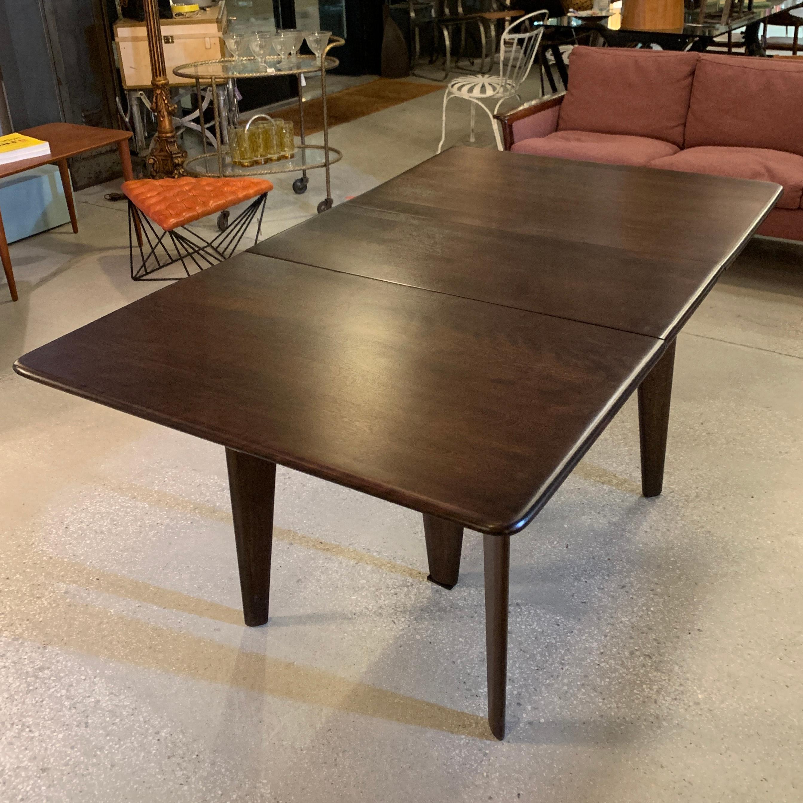Mid-Century Modern, maple, gate fold, drop leaf, dining table by Heywood Wakefield in an ebonized finish, can be used with one or both leaves up and folds down to a 15 inch wide console that can easily be tucked away.