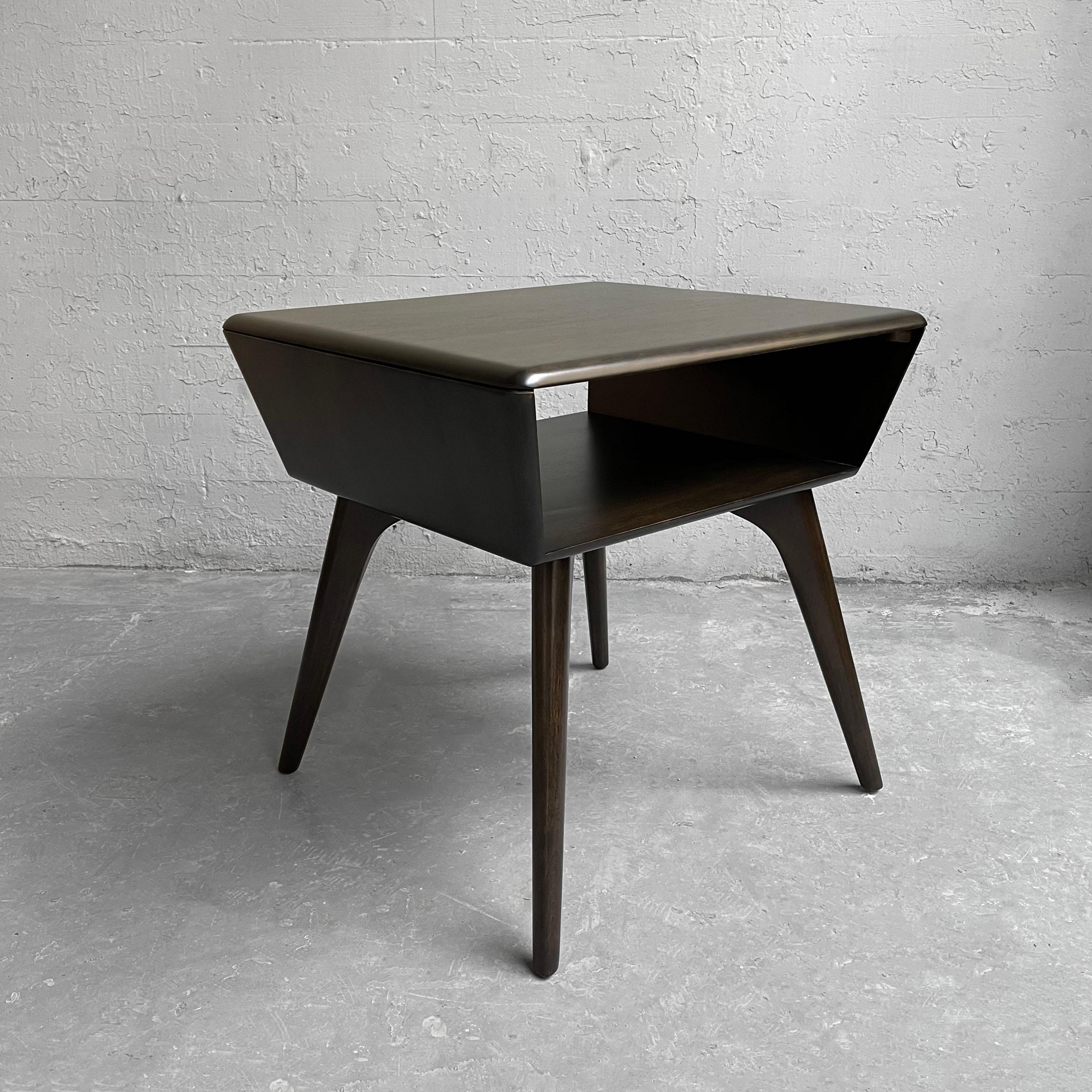 Classic, Mid-Century Modern, ebonized maple, open side table or lamp table by Heywood Wakefield features an open compartment for books or magazines at 6.5 inches height.
