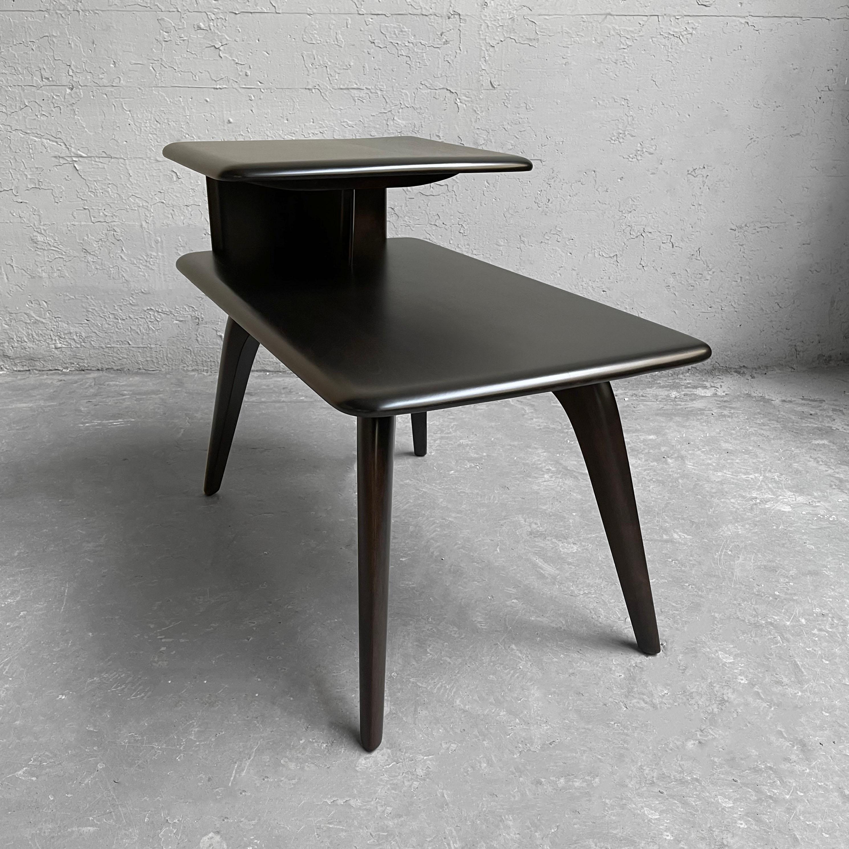 Classic, Mid-Century Modern, ebonized maple, step side table by Heywood Wakefield features a lower tier at 16 inches height and recessed upper tier at 16 inches deep.