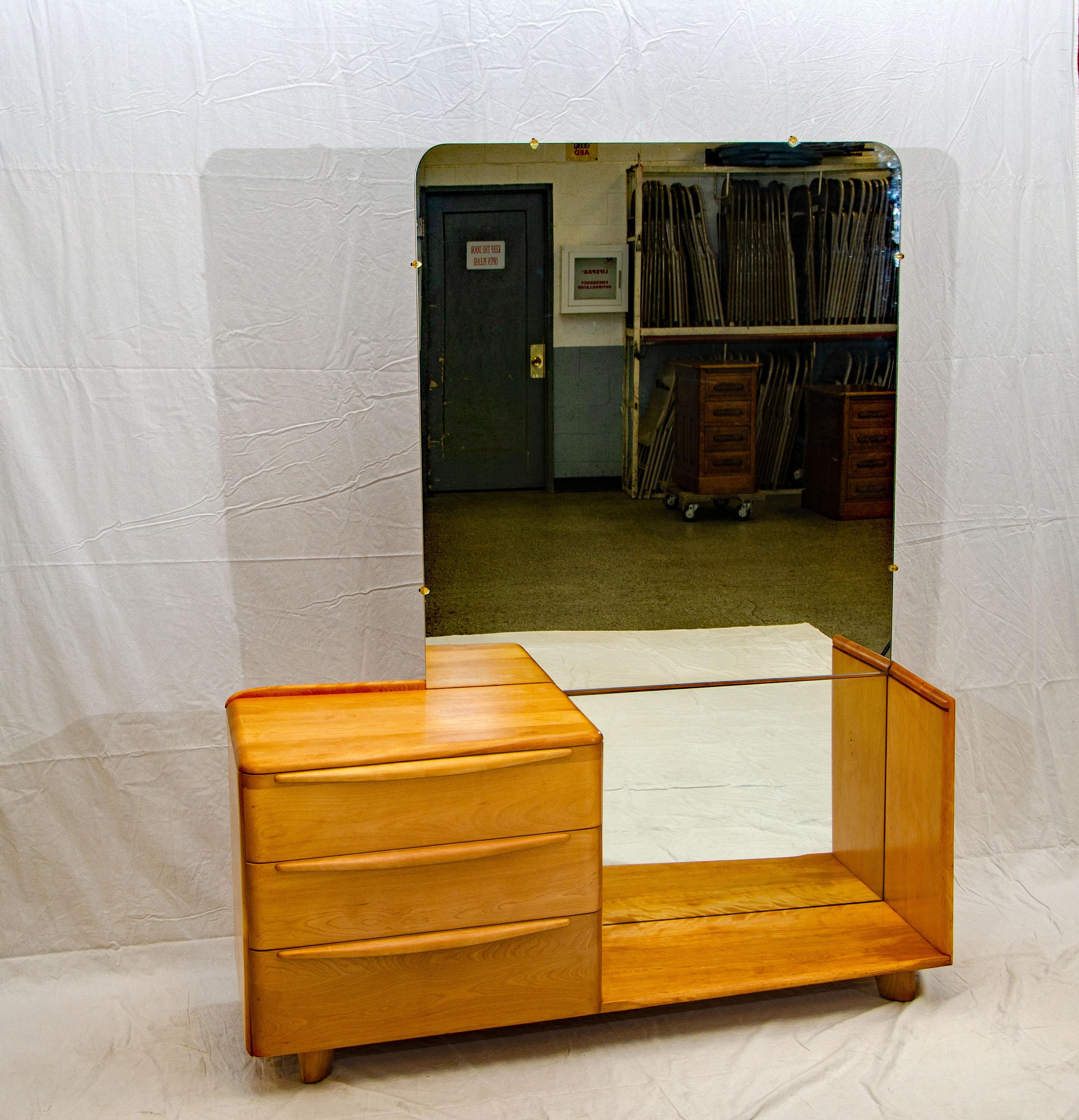 This angular vanity has both the full-length mirror feature and some drawer storage. The drawer section measures 26