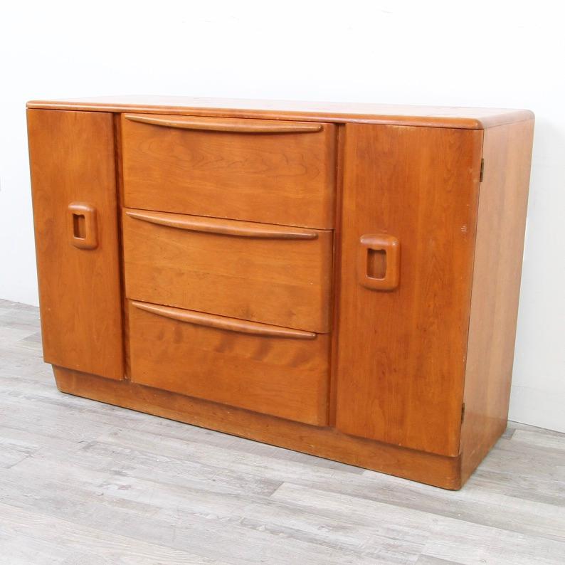 One of the reasons Heywood Wakefield pieces are still around 60 years later and still popular among collectors is the fact that they are made of sold hardwoods; no veneers. This credenza from the fifties is in their wheat finish, which is a little