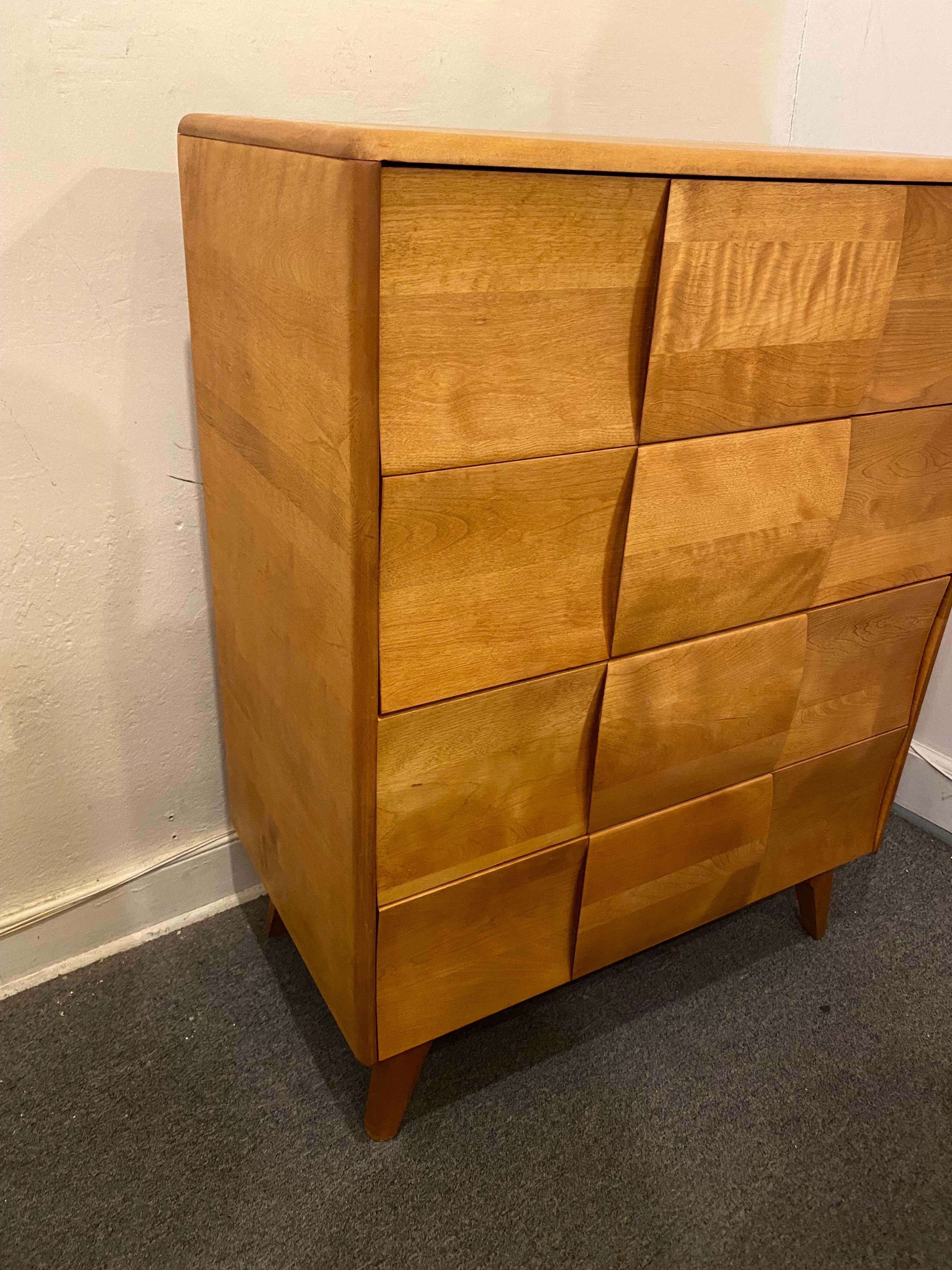 Heywood Wakefield 4 Drawer Kohinoor Dresser.  One of my favorite designs from Wakefield!  Dimensional drawer fronts form the handles.  Recently refinished and ready to go!.  Inside drawers have been cleaned but do show some staining.