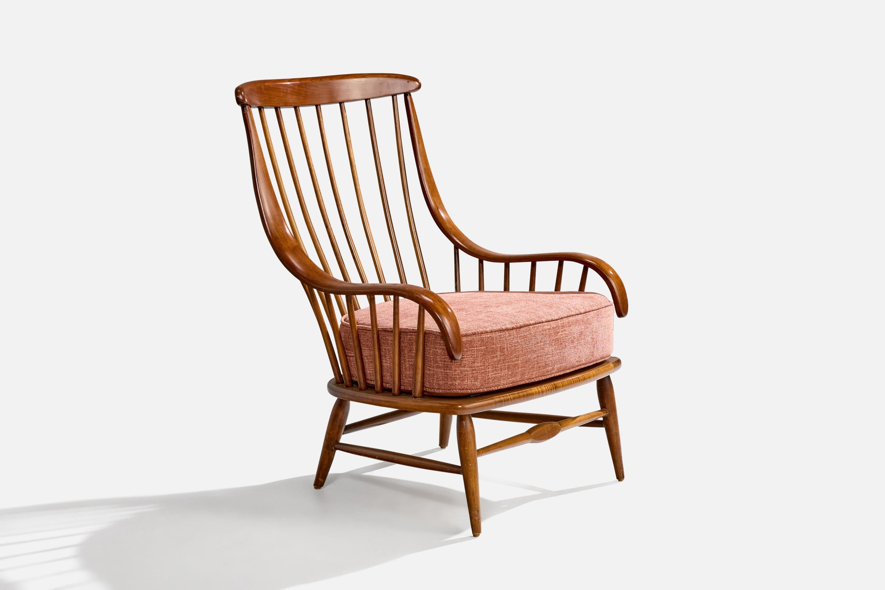 A dark-stained wood and red fabric lounge chair produced by Heywood-Wakefield, USA, c. 1950s.

Overall Dimensions (inches): 37.125