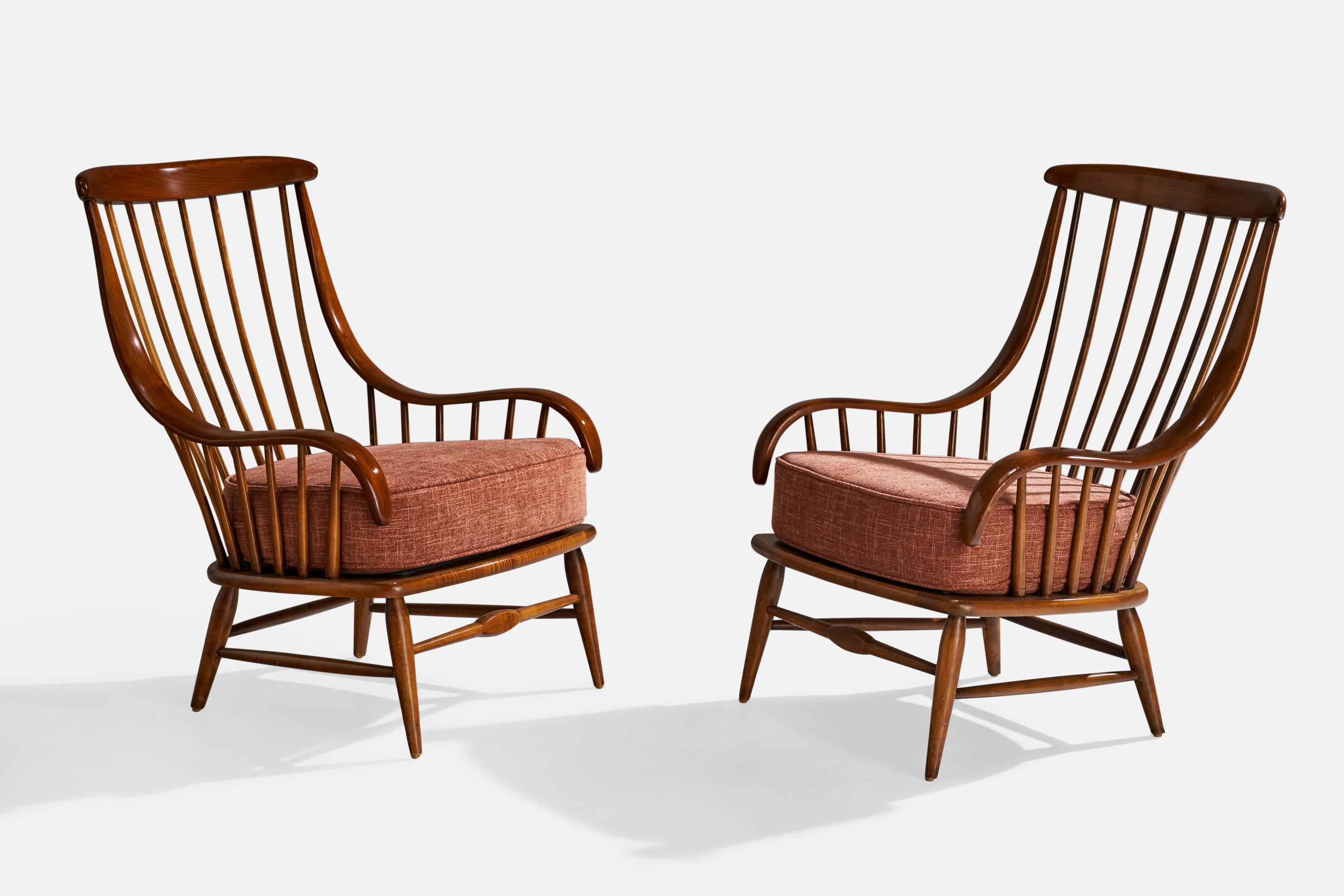 A pair of dark-stained wood and red fabric lounge chairs produced by Heywood-Wakefield, USA, c. 1950s.

Dimensions: 37” H x 27.5” W x 30” D

Seat height: 18”