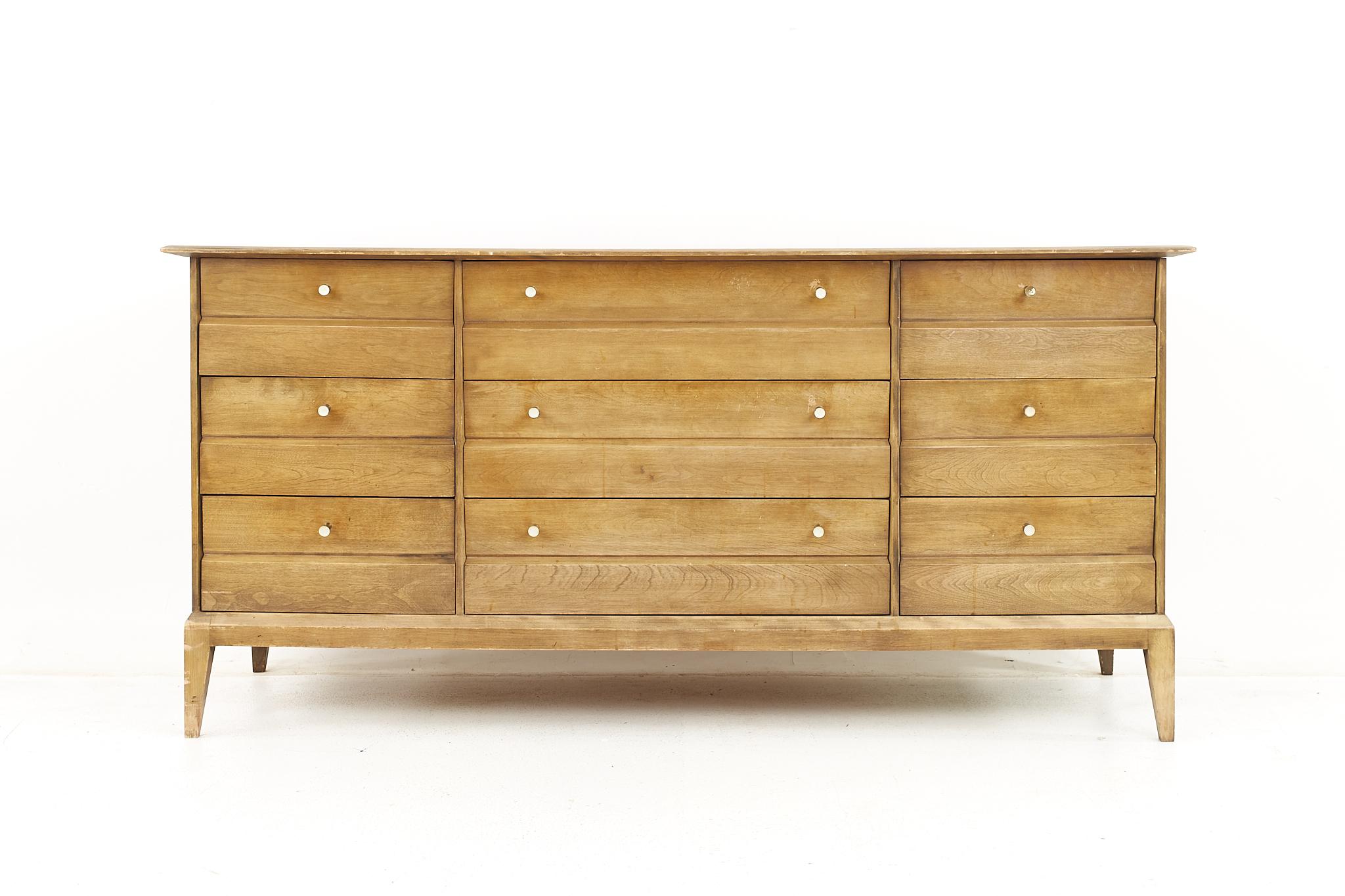 Heywood Wakefield mid century 9 drawer lowboy dresser

The dresser measures: 65 wide x 21.5 deep x 31.5 inches high

All pieces of furniture can be had in what we call restored vintage condition. That means the piece is restored upon purchase so