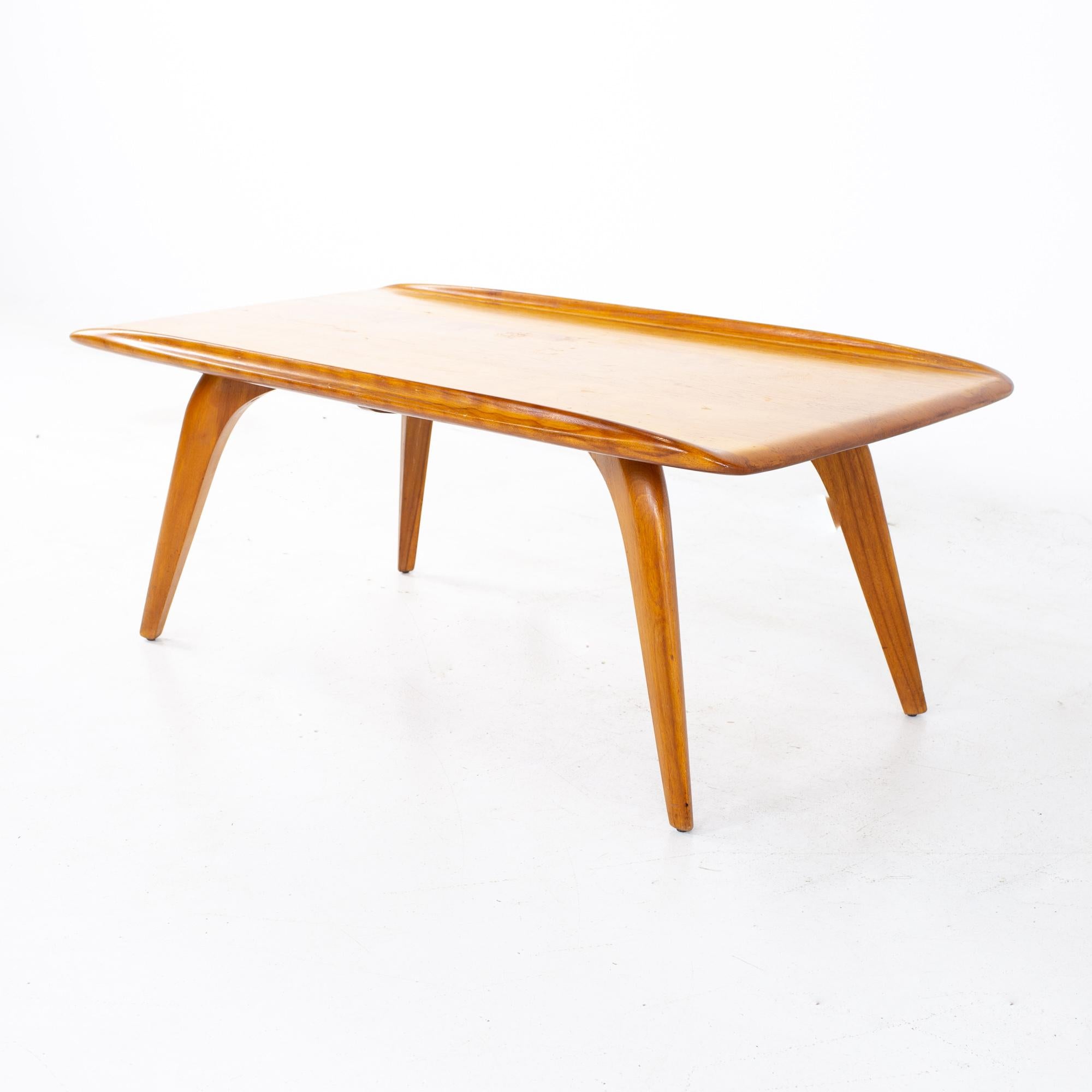 Heywood Wakefield mid century coffee table
Table measures: 45.5 wide x 22.5 deep x 16 inches high

All pieces of furniture can be had in what we call restored vintage condition. That means the piece is restored upon purchase so it’s free of