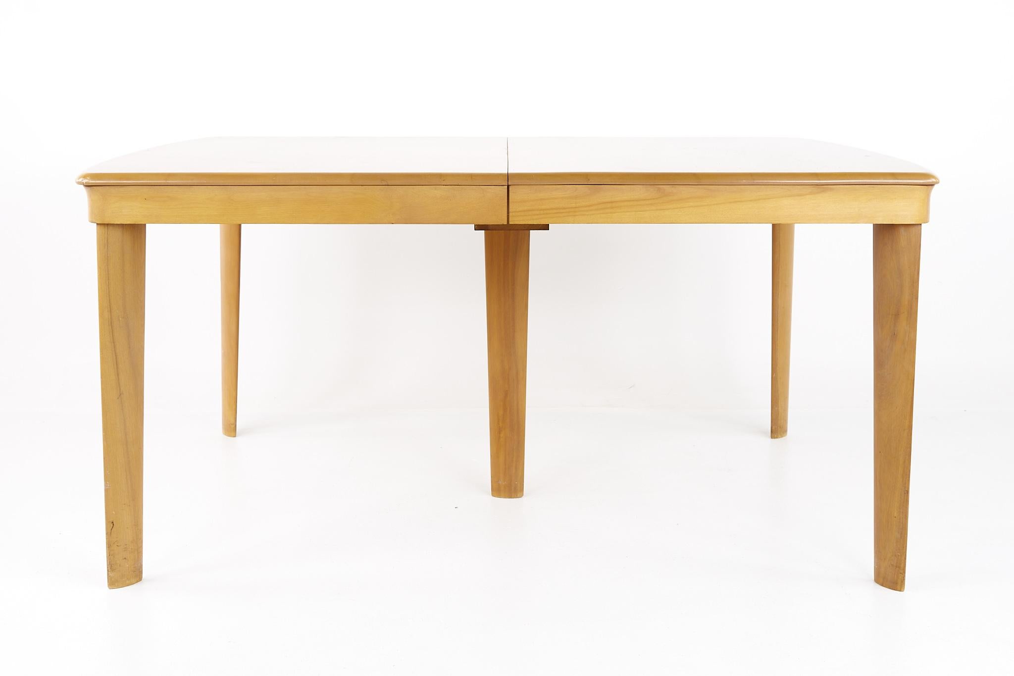 Heywood Wakefield mid century dining table

This table measures: 61 wide x 42.5 deep x 29 inches high, with a chair clearance of 25.5 inches, each of the 2 leaves are 15 wide making a maximum table width of 91 inches

All pieces of furniture can