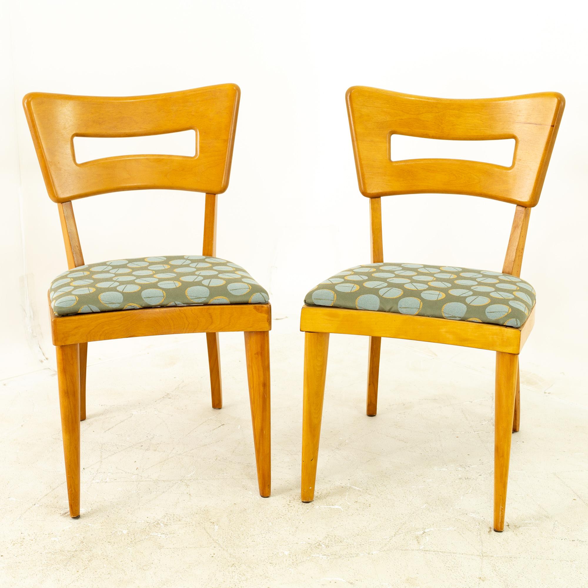 Heywood Wakefield mid century maple dog bone dining chairs - pair

Each chair measures 18 wide x 20 deep x 33 high with a seat height of 18 inches

All pieces of furniture can be had in what we call restored vintage condition. That means the