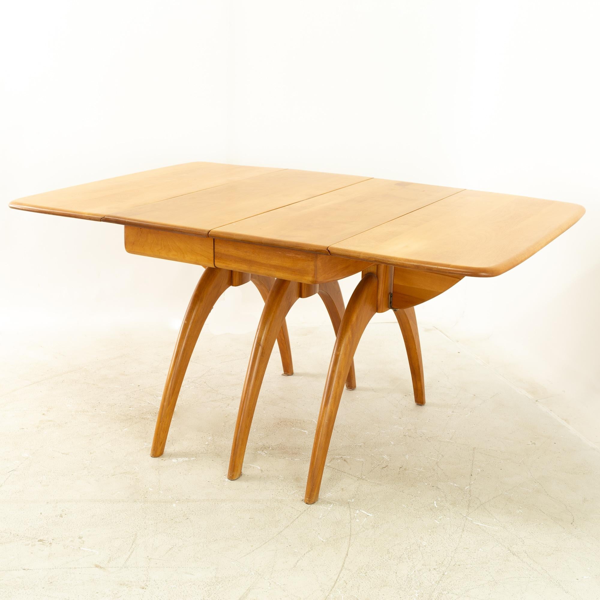 Heywood Wakefield mid century maple wishbone expanding dining table
This table measures 58 wide x 40 deep x 28.75 inches high and is 92 inches wide when expanded

All pieces of furniture can be had in what we call restored vintage condition. That