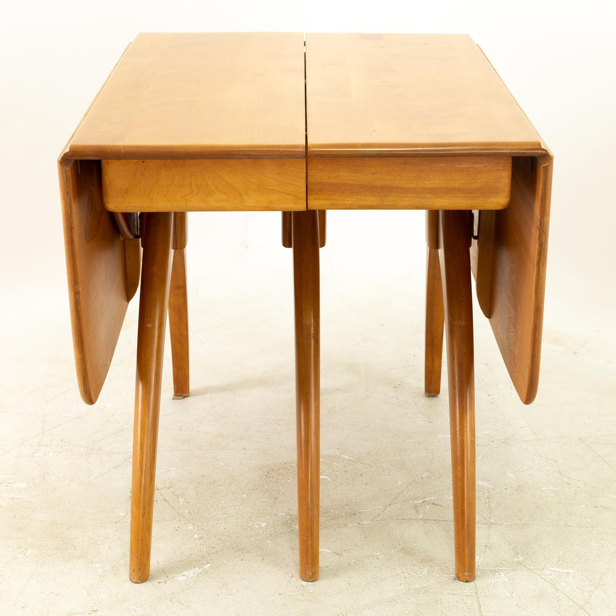 Heywood Wakefield mid century maple wishbone expanding dining table 

This table measures 58 wide x 40 deep x 28.75 inches high and is 92 inches wide when expanded

All pieces of furniture can be had in what we call restored vintage condition.