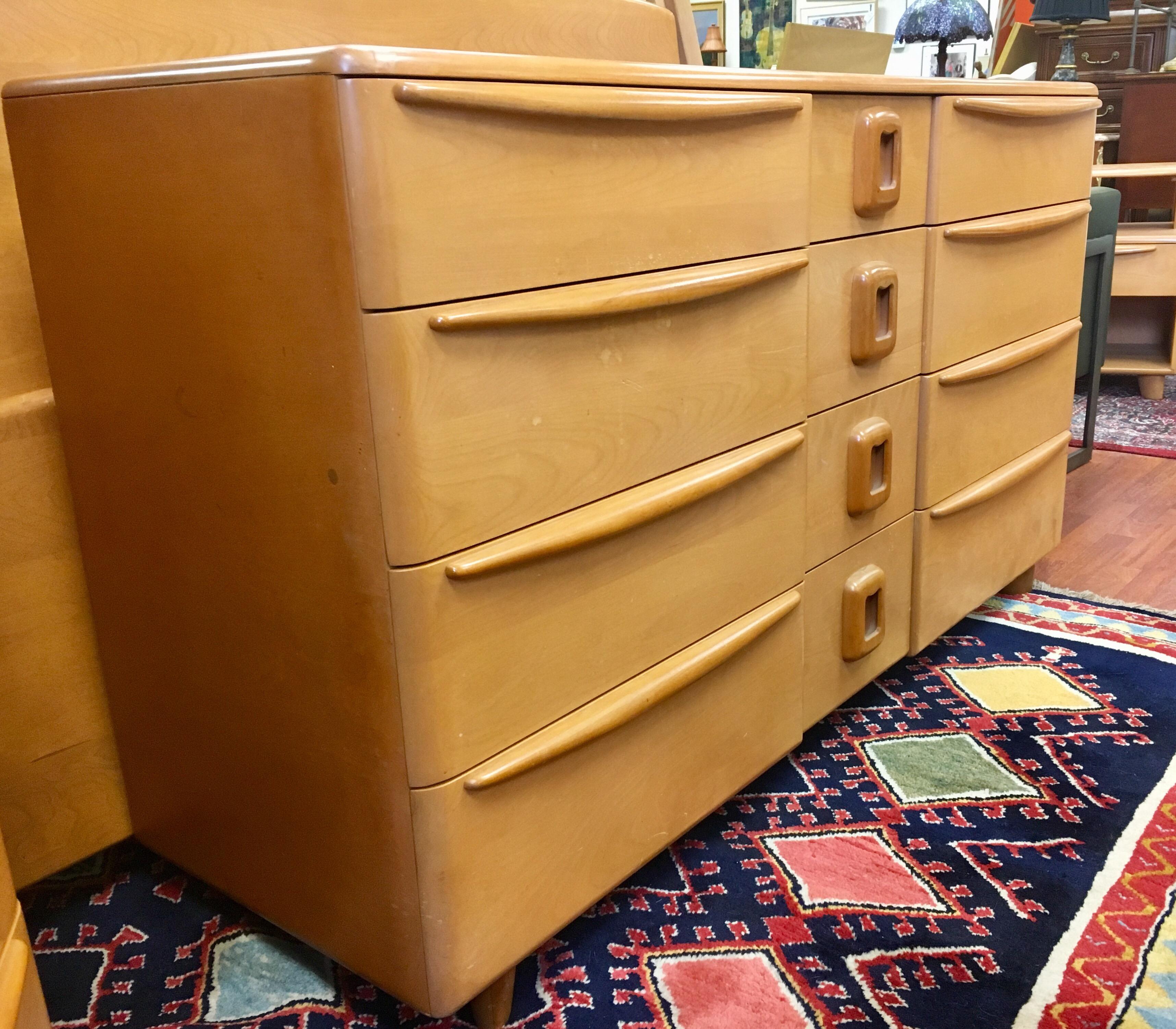 Elegant and rare Heywood Wakefield twelve drawer champagne chest of drawers. This dresser features the coveted drawer pulls, see pics. One of several pieces of this collection we will sell this week on this platform.