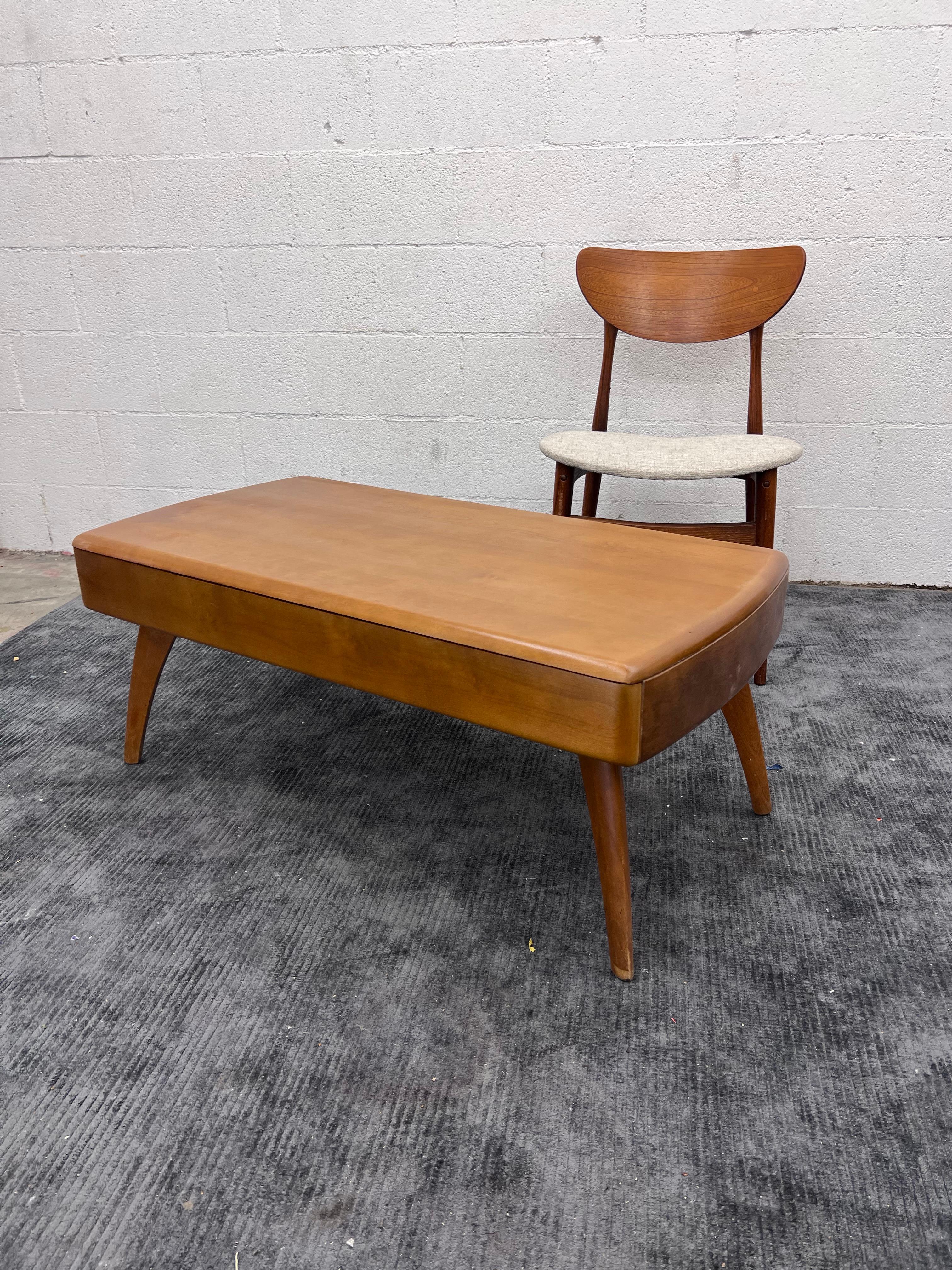 1956 Heywood Wakefield cocktail table with drawer. Concealed within the smooth lines of this table is a drawer running its full length and width. 
Makers date April 1956 

Model: M 905 G.