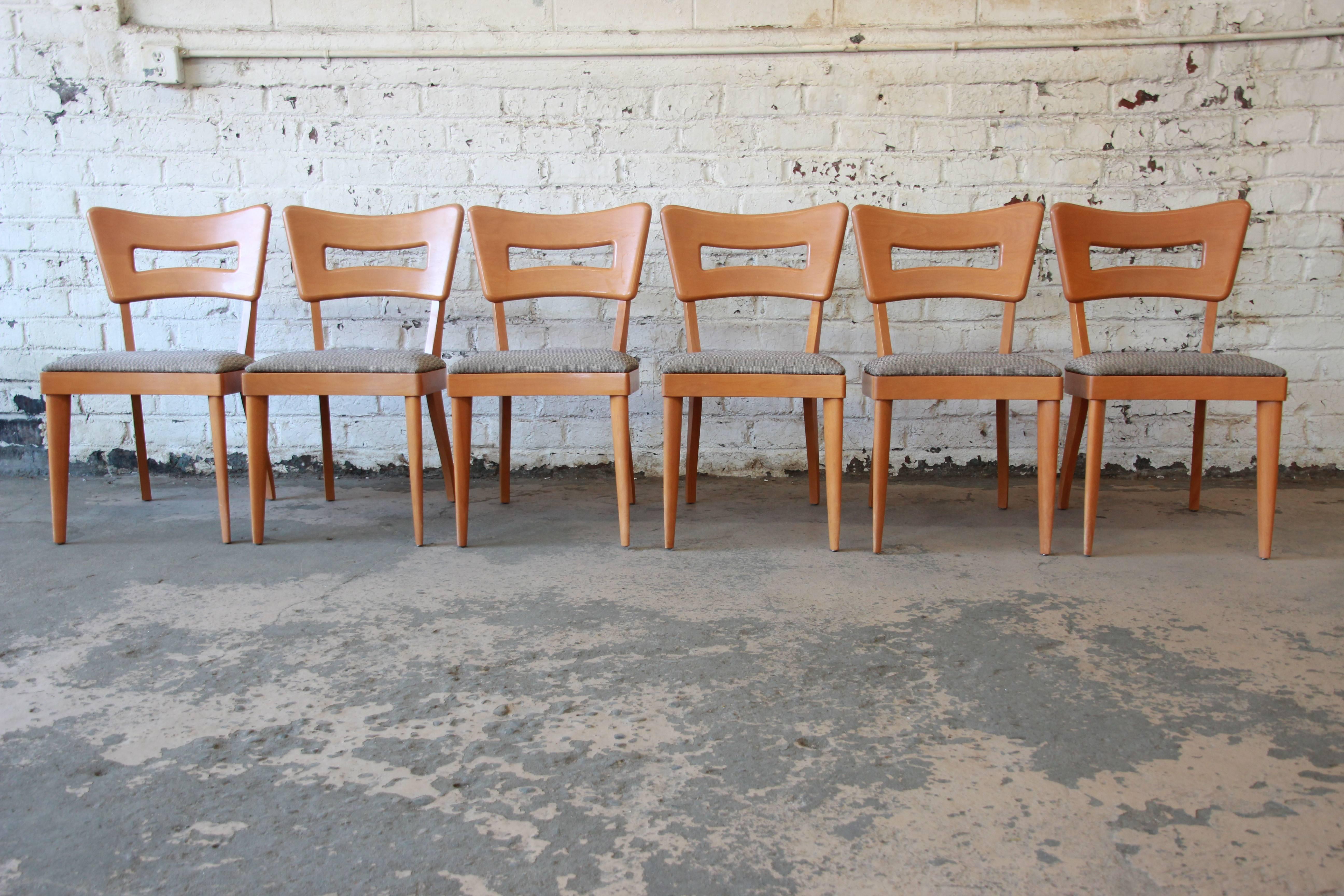 Offering a very nice and excellently cared for set of six 'dogbone' Heywood-Wakefield. The set of six side chairs have recently been reupholstered and are a highly desired style from the 1950s. The chair have great ergonomics and are in excellent