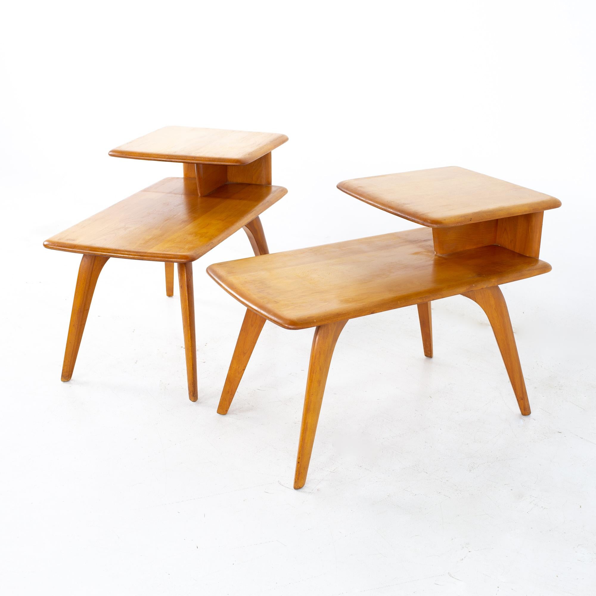 Heywood Wakefield Mid Century step side tables, a pair
Each table measures: 29.5 wide x 17 deep x 22 inches high

All pieces of furniture can be had in what we call restored vintage condition. That means the piece is restored upon purchase so