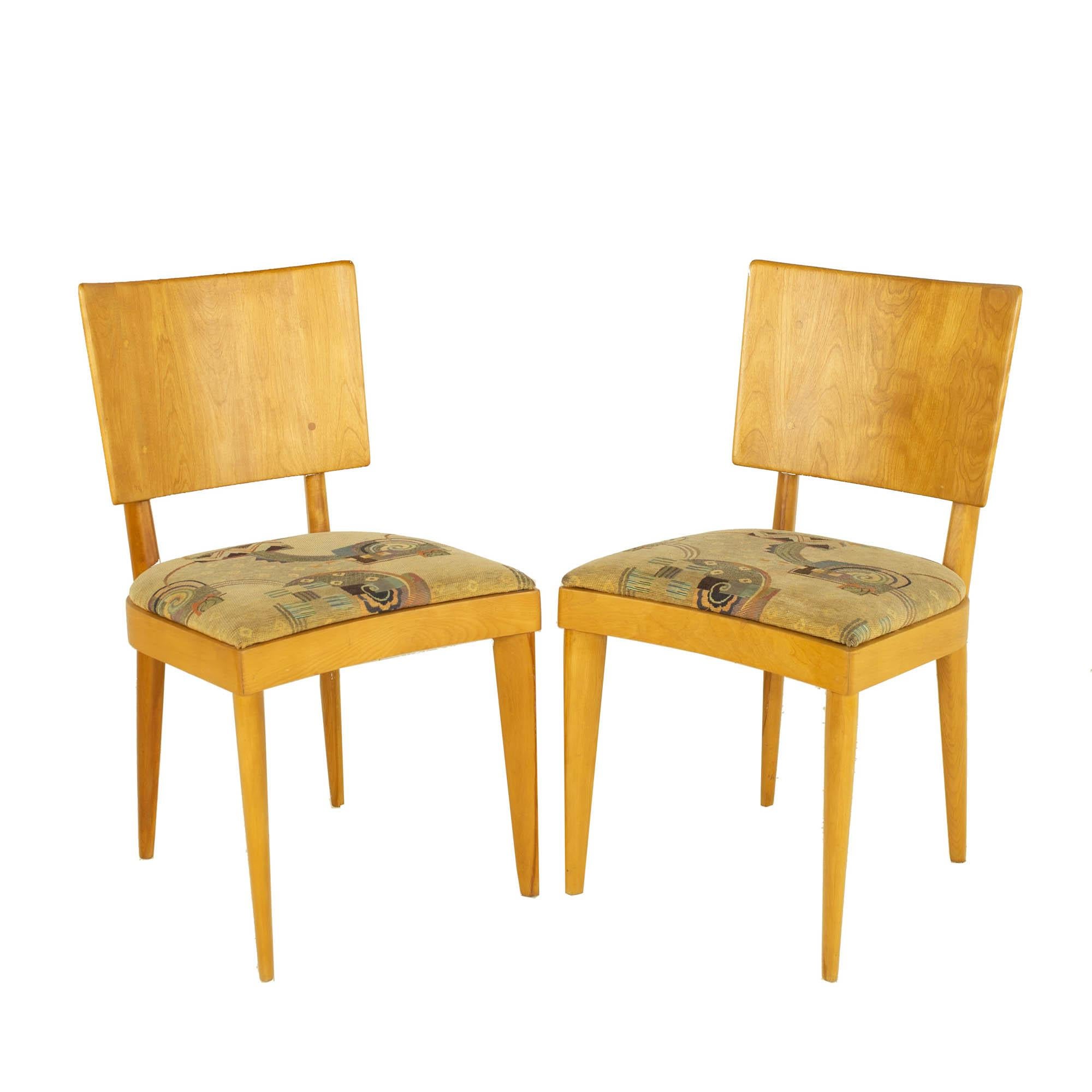 Heywood Wakefield mid century wheat solid wood dining chairs - A Pair

Each chair measures: 17.75 wide x 20.25 deep x 32.75 inches high, with a seat height of 18 inches

All pieces of furniture can be had in what we call restored vintage
