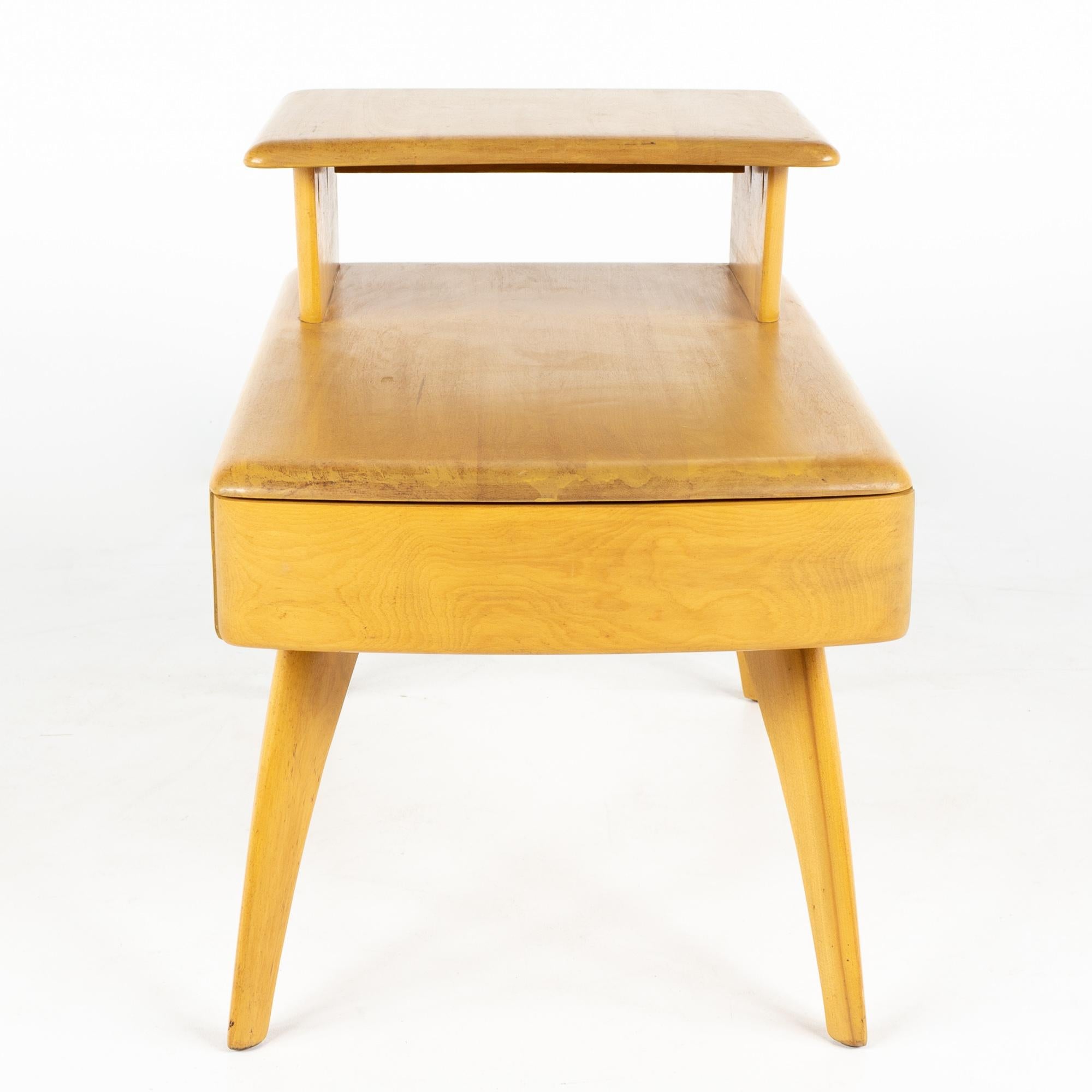 Heywood Wakefield mid century wheat step side table with drawer

This table measures: 18.5 wide x 30.5 deep x 23 inches high

All pieces of furniture can be had in what we call restored vintage condition. That means the piece is restored upon