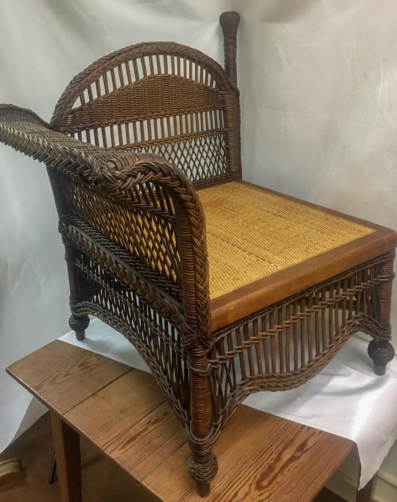 This charming Natural honey colored wicker divan was made by the Heywood-Wakefield Company around the turn of the last century. Features include round plied reed at post and wrapped feet, two ply braiding at the dome top, dual diagonally woven reed