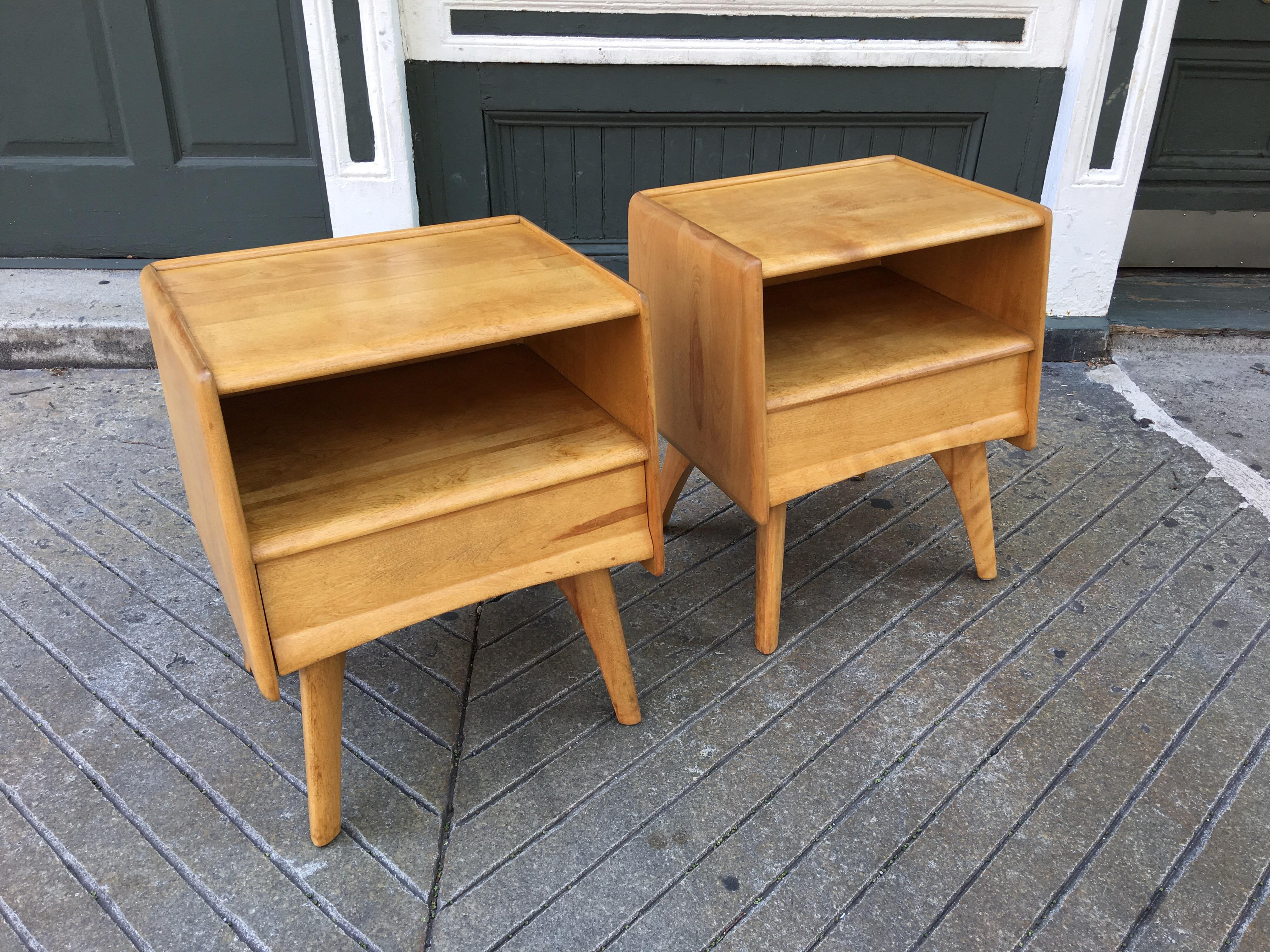Nice newly refinished pair of Heywood Wakefield nightstands. Each stand has one pullout / pull-out drawer, and open space below top. Solid maple construction!