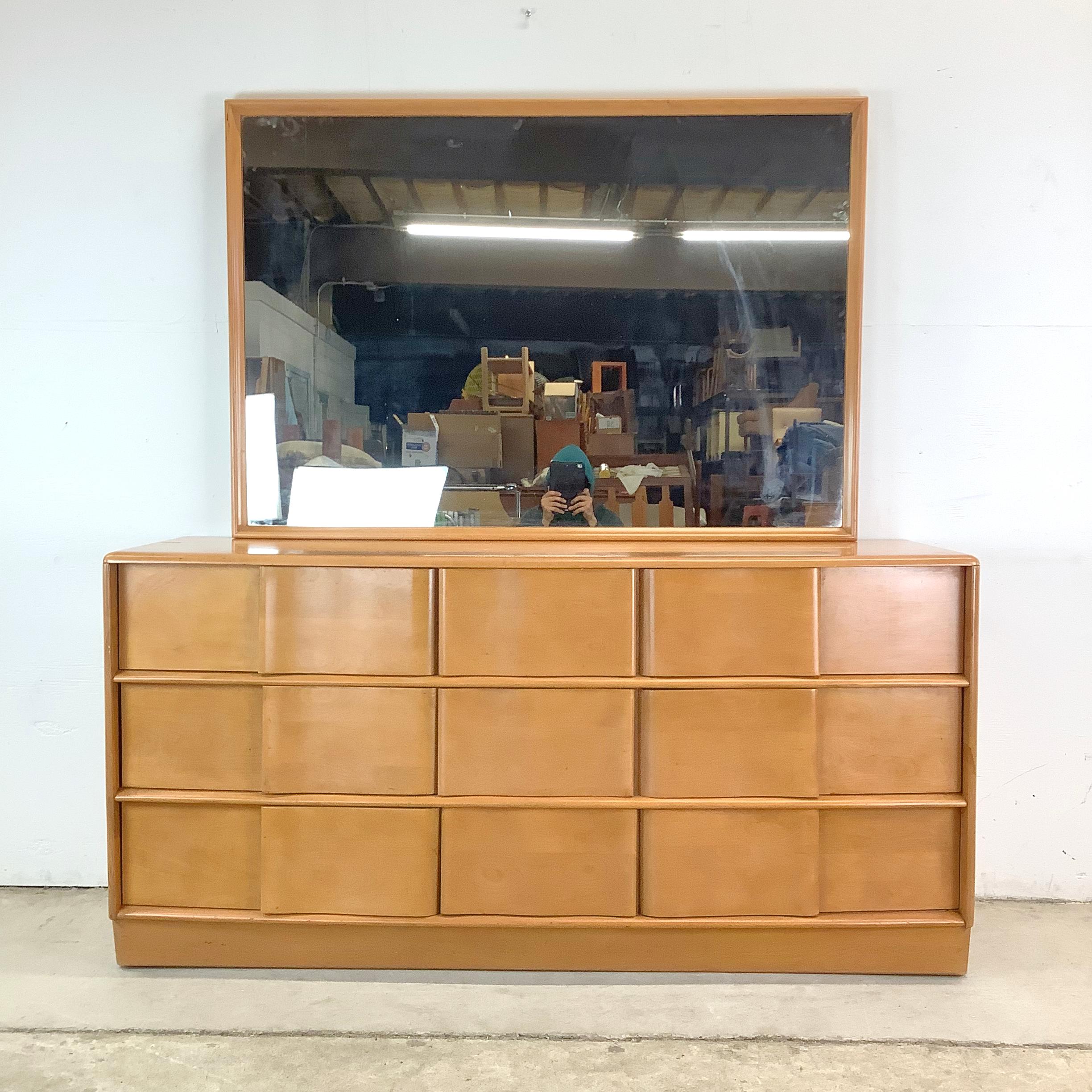 Timeless, tactile, and sculptural—this nine-drawer Heywood-Wakefield dresser with mirror embodies the very best of mid-century American design. Part of the iconic Sculptura collection, it’s a piece that manages to feel both grounded and airy,