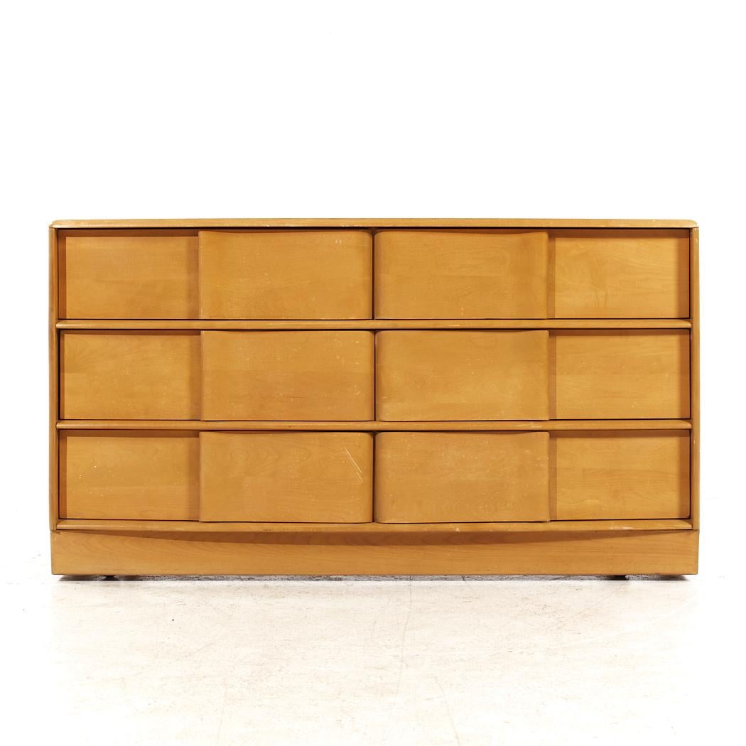 Heywood Wakefield Sculptra Mid Century Wheat 6 Drawer Dresser

This lowboy measures: 56 wide x 19.25 deep x 31.25 inches high

All pieces of furniture can be had in what we call restored vintage condition. That means the piece is restored upon