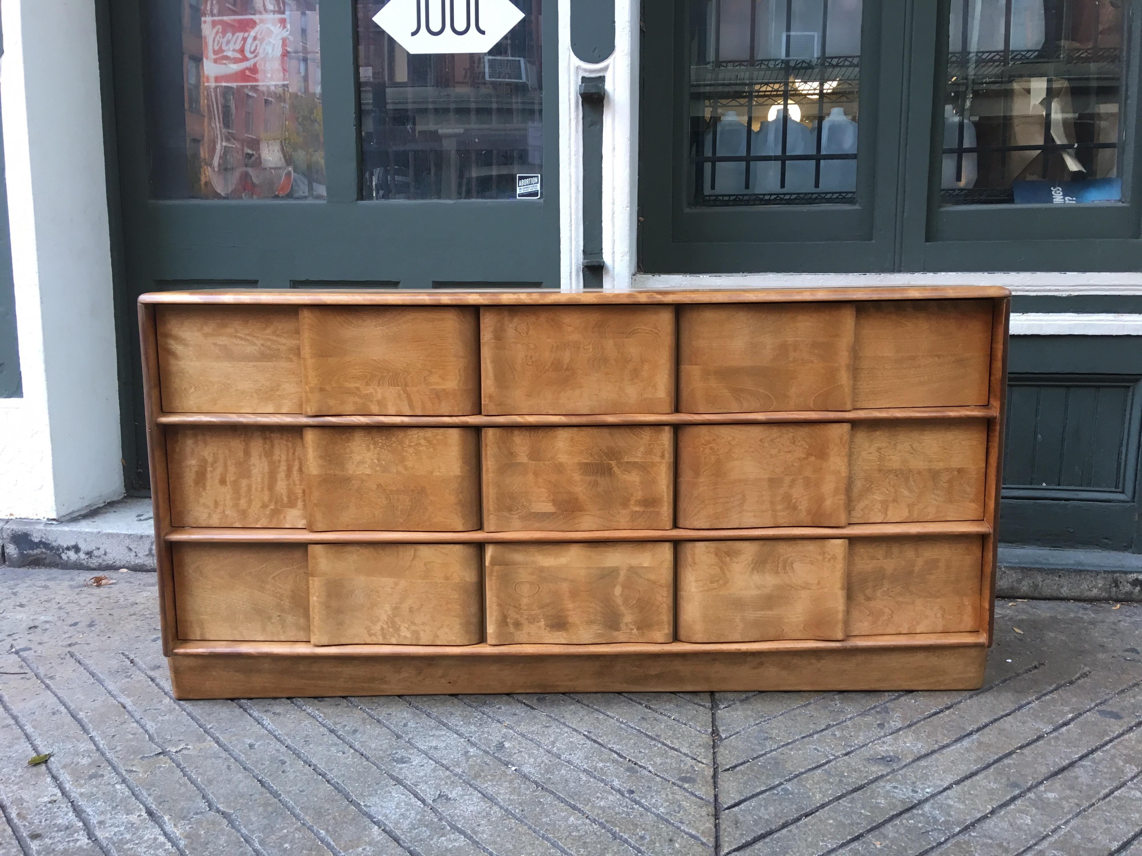 Nice 9 drawer Heywood Wakefield Sculptura dresser, two currently available. One has a slightly darker blond finish than the other one. 3 drawers at each end with 3 smaller drawers in the middle. Solid wood construction! Heywood Wakefield used solid
