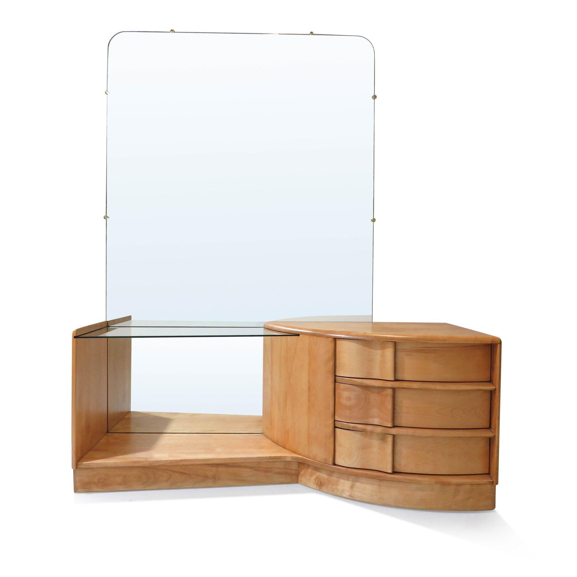 Beautifully restored Midcentury Heywood Wakefield Sculptura vanity with mirror crafted of solid maple with three drawers and glass shelf, and large mirror.

The wood has been completely restored and is in near perfect condition. 
Measurements:
W