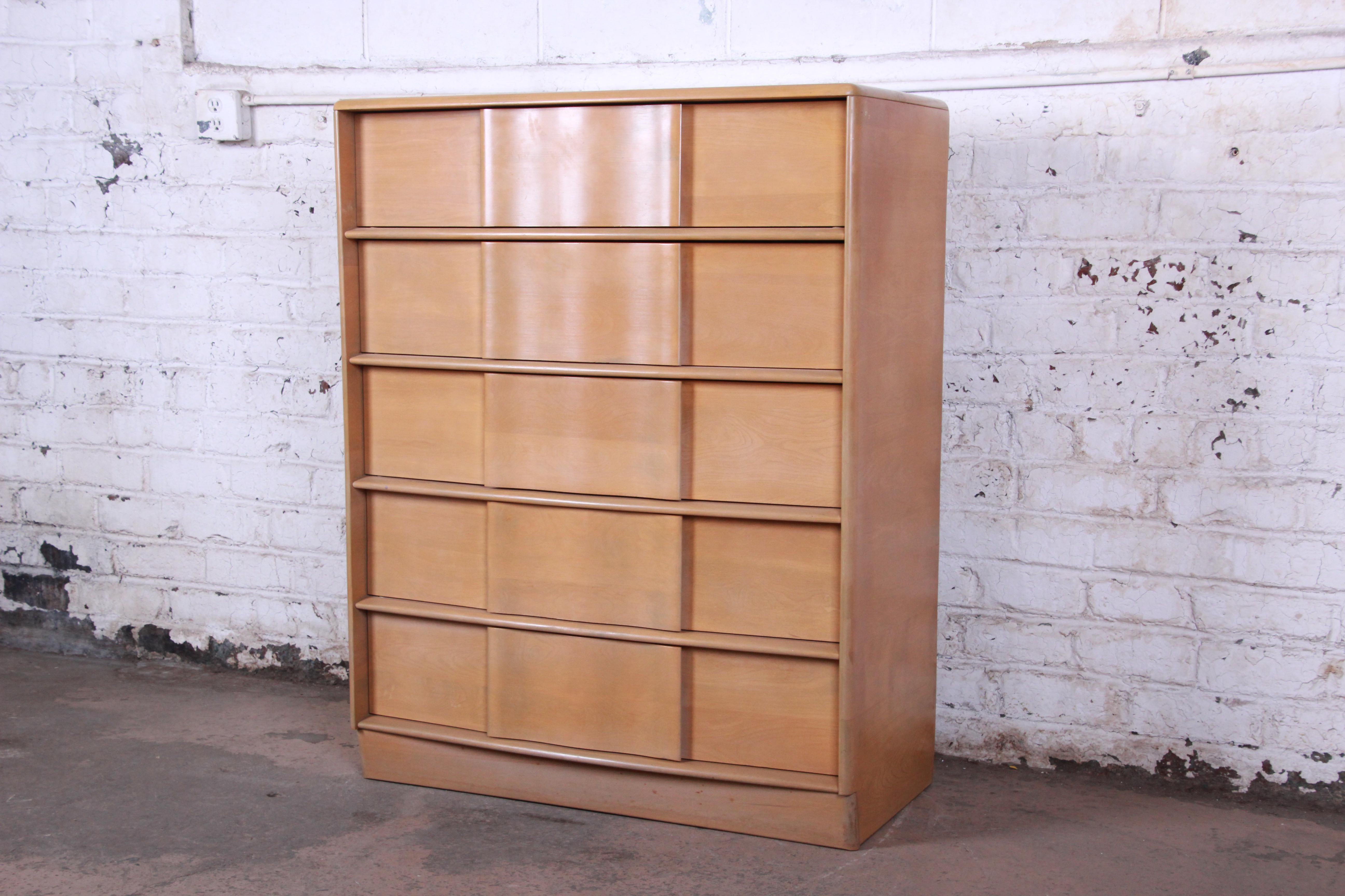 A gorgeous Mid-Century Modern sculpted solid maple 