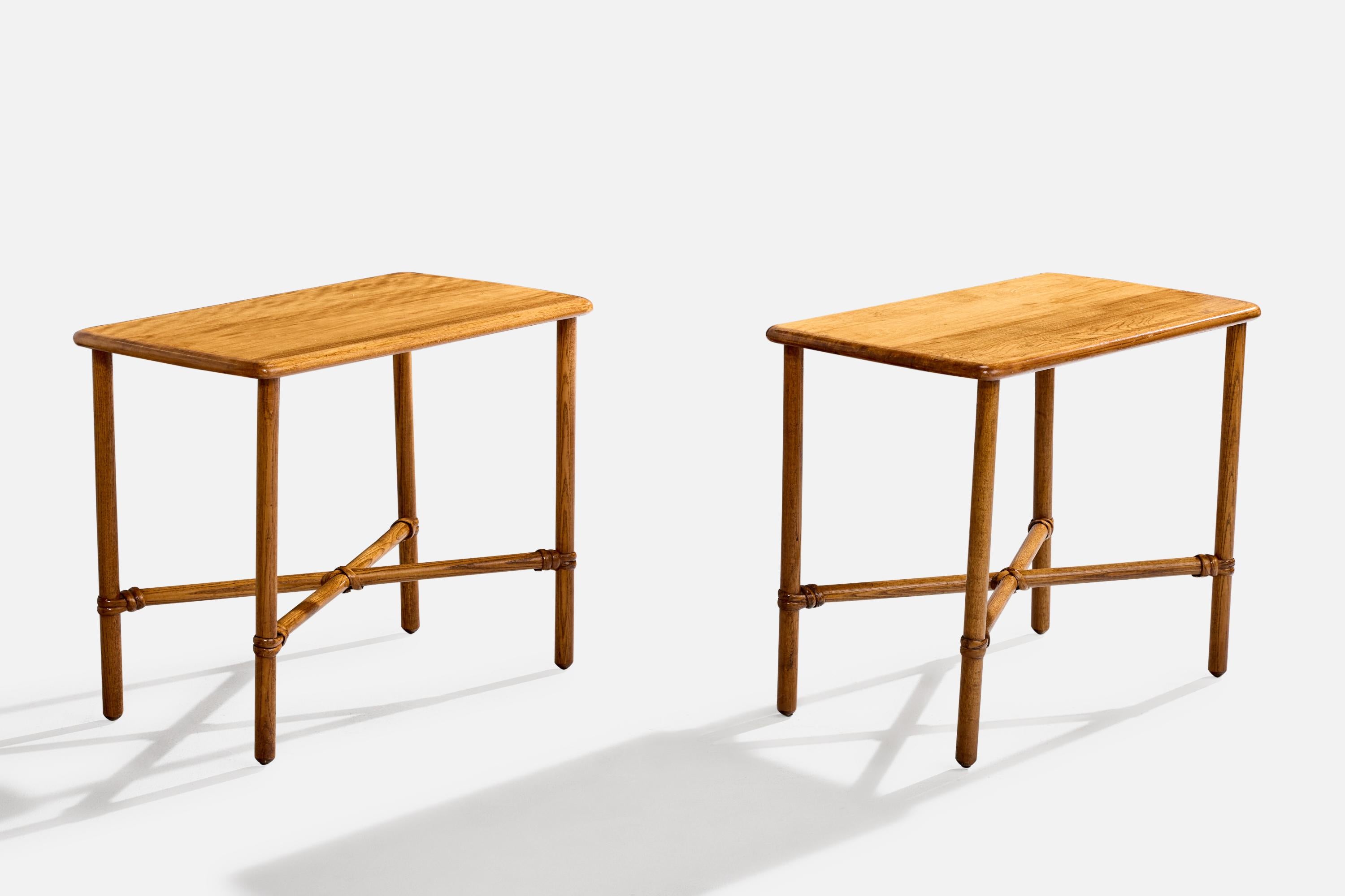 A pair of oak and rattan side tables produced by Heywood Wakefield, USA, c. 1950s.

Overall Dimensions (inches): 20.625