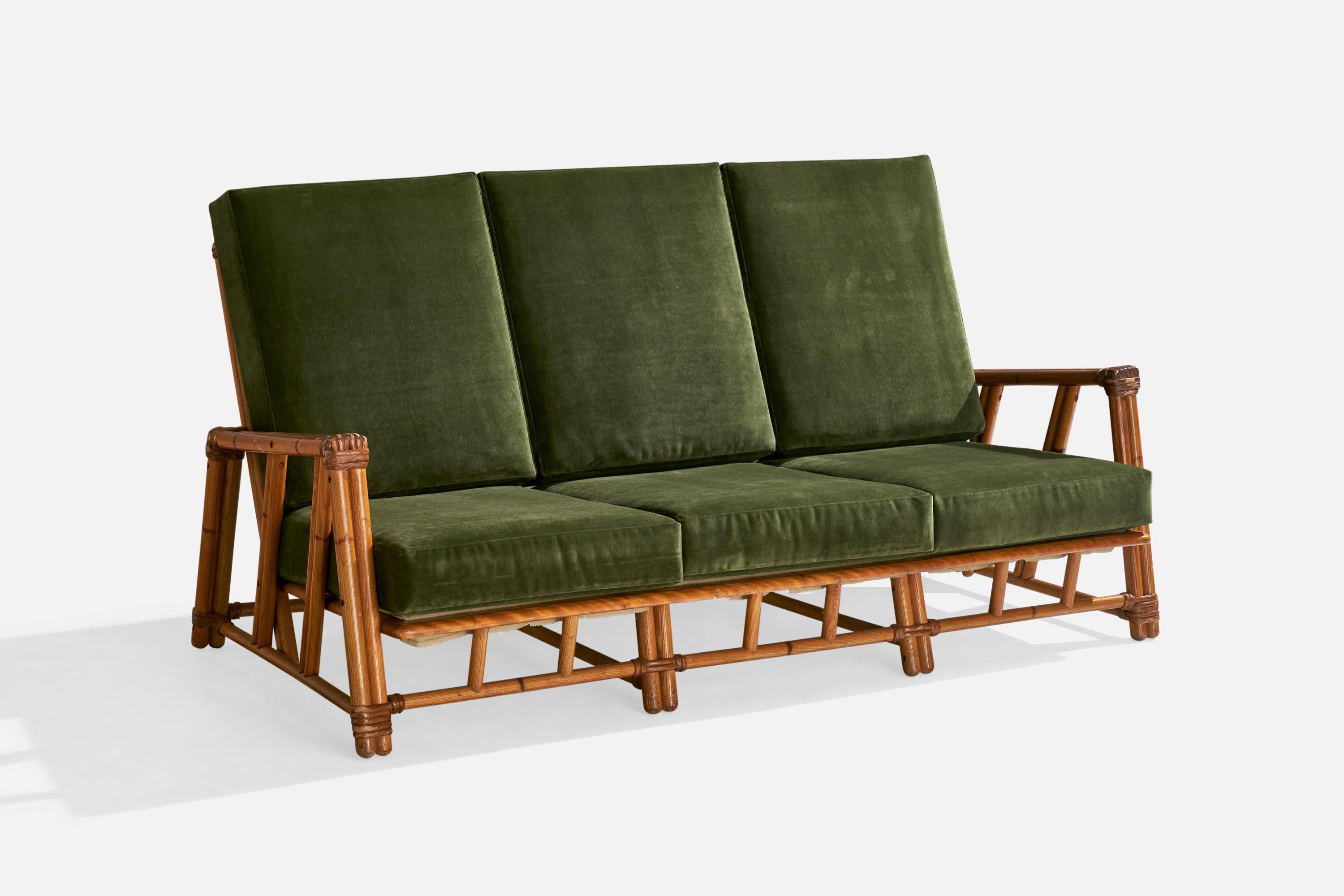 A green velvet, rattan and oak sofa with painted bamboo details produced Heywood Wakefield, USA, c. 1950s.

Dimensions: 37.25” H x 72” W x 34.375” D

Seat height: 15” 