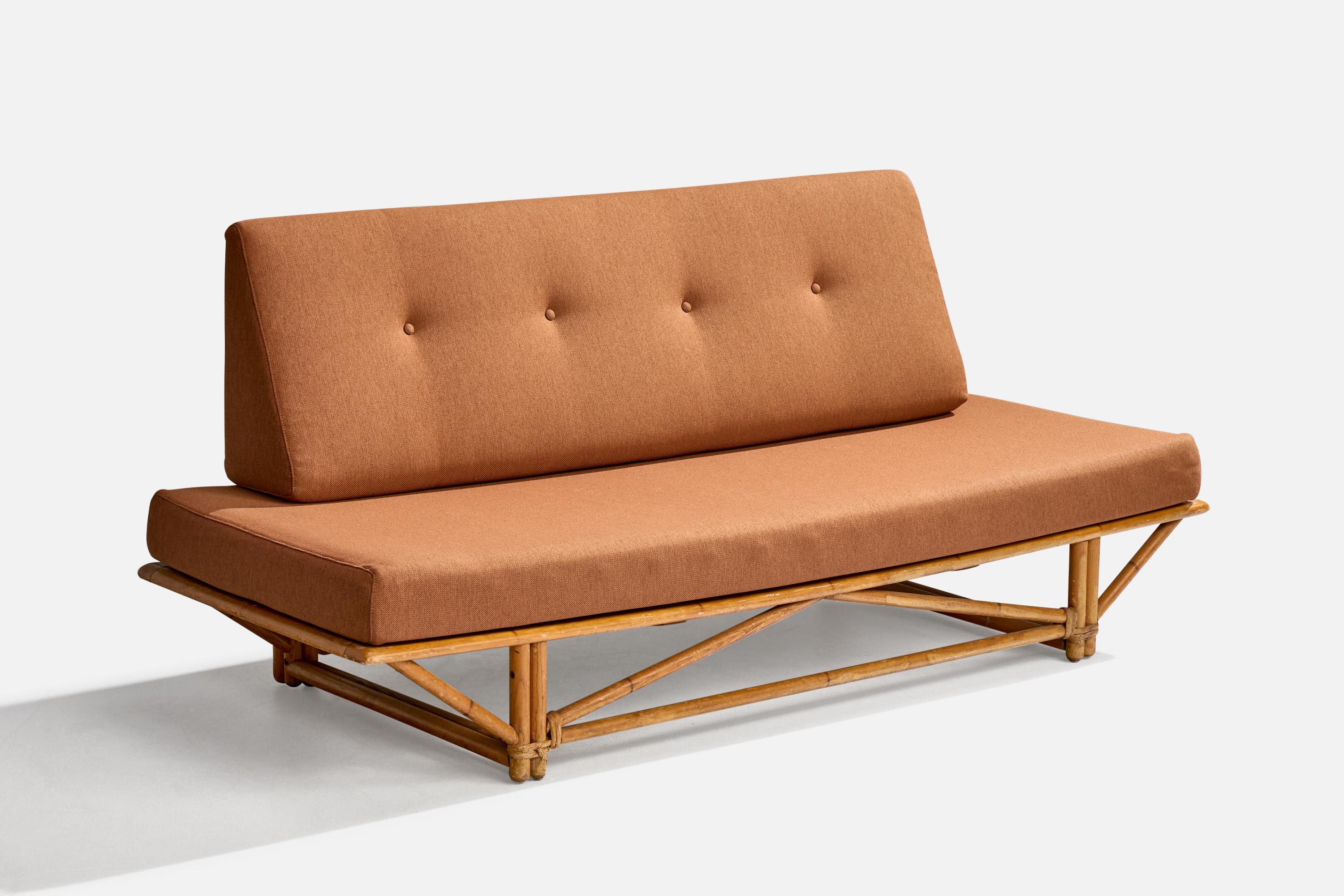 A red fabric, rattan and oak sofa with painted bamboo details produced Heywood Wakefield, USA, c. 1950s.

Overall Dimensions (inches): 33.25