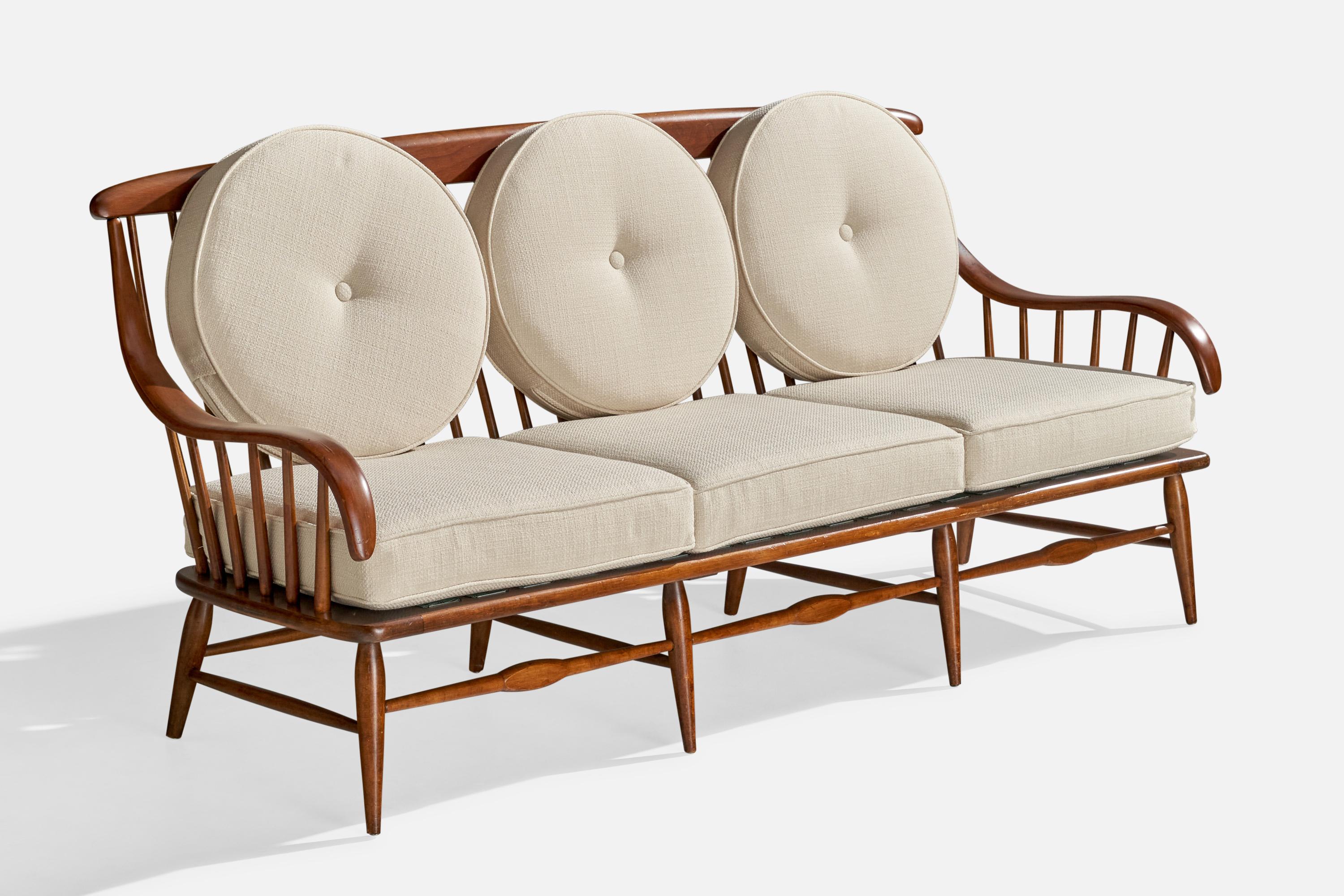 Sofá o canapé de nogal y tela fabricado por Heywood Wakefield, EE.UU., c. 1940. 