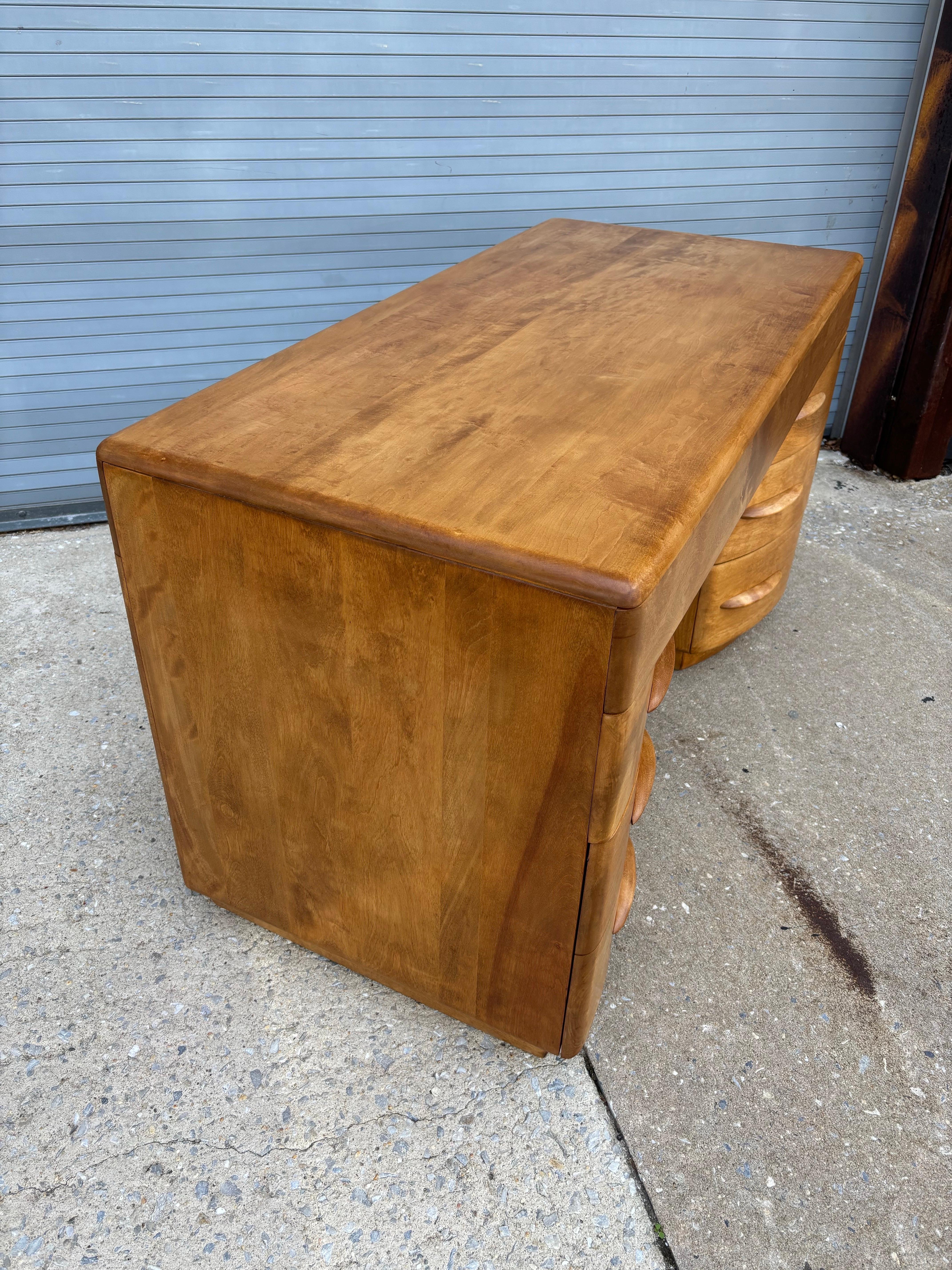 Heywood Wakefield Solid Maple Curved Front Desk.  One of my favorite Wakefield Designs!  Practical and well Built!  This is a workhorse desk that gets the job done well adding great design to a room!  One of the few American Made Solid Wood