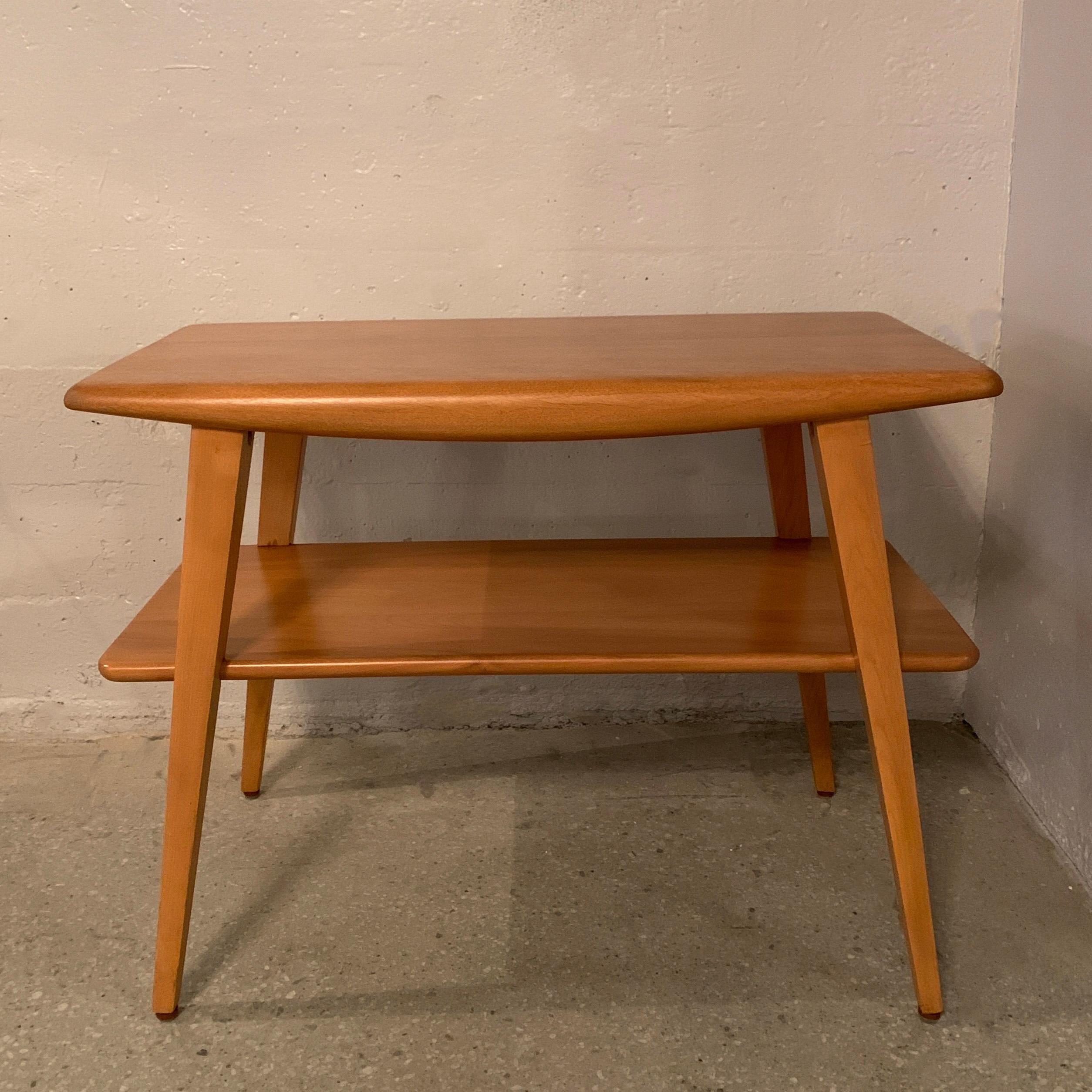Classic, Mid-Century Modern, tiered birch side table by Heywood Wakefield Co. features a lower tier at 12 inches height.