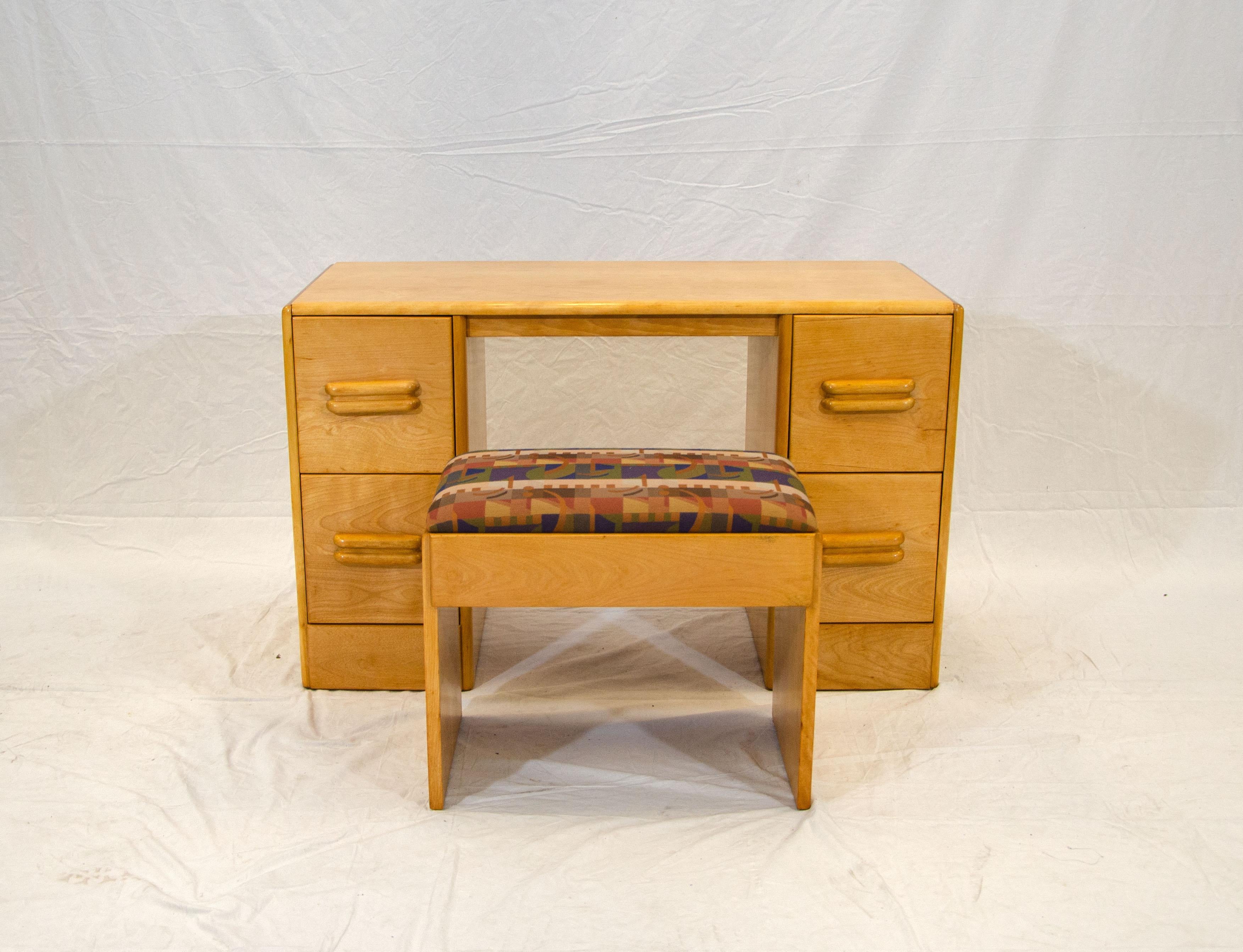 This streamline modern vanity with a bench would be a great desk for a child or if used as a vanity, a mirror can be mounted on the wall. The bench is 21