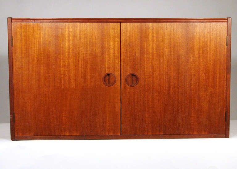 Midcentury floating wall unit by H.G. Furniture, Denmark. This wall unit comes with three adjustable shelves, a flip-top for changing records and cut-out in both the bottom and shelves for wire leads should you use this as a case for AV