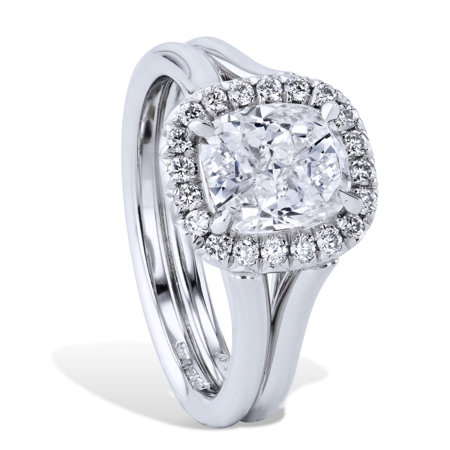 GIA Certified 2.02 Carat Diamond and Platinum Halo Engagement Ring made by H&H 

Add some sparkle to your finger with this 2.02 carat diamond (H/VS1, GIA Cert. #3195594416) engagement ring, centered in a halo pave set diamonds with a total weight of
