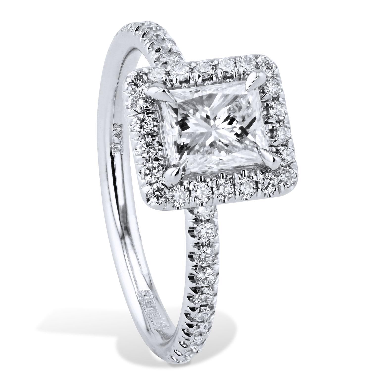 GIA Certified 0.92 Carat Radiant Cut Diamond Engagement Ring Handmade by H&H

Handmade with love, this ring features a 0.92 carat radiant cut diamond centered in a halo with a platinum shank of 0.34 carats of pave set diamonds. 

GIA Cert.