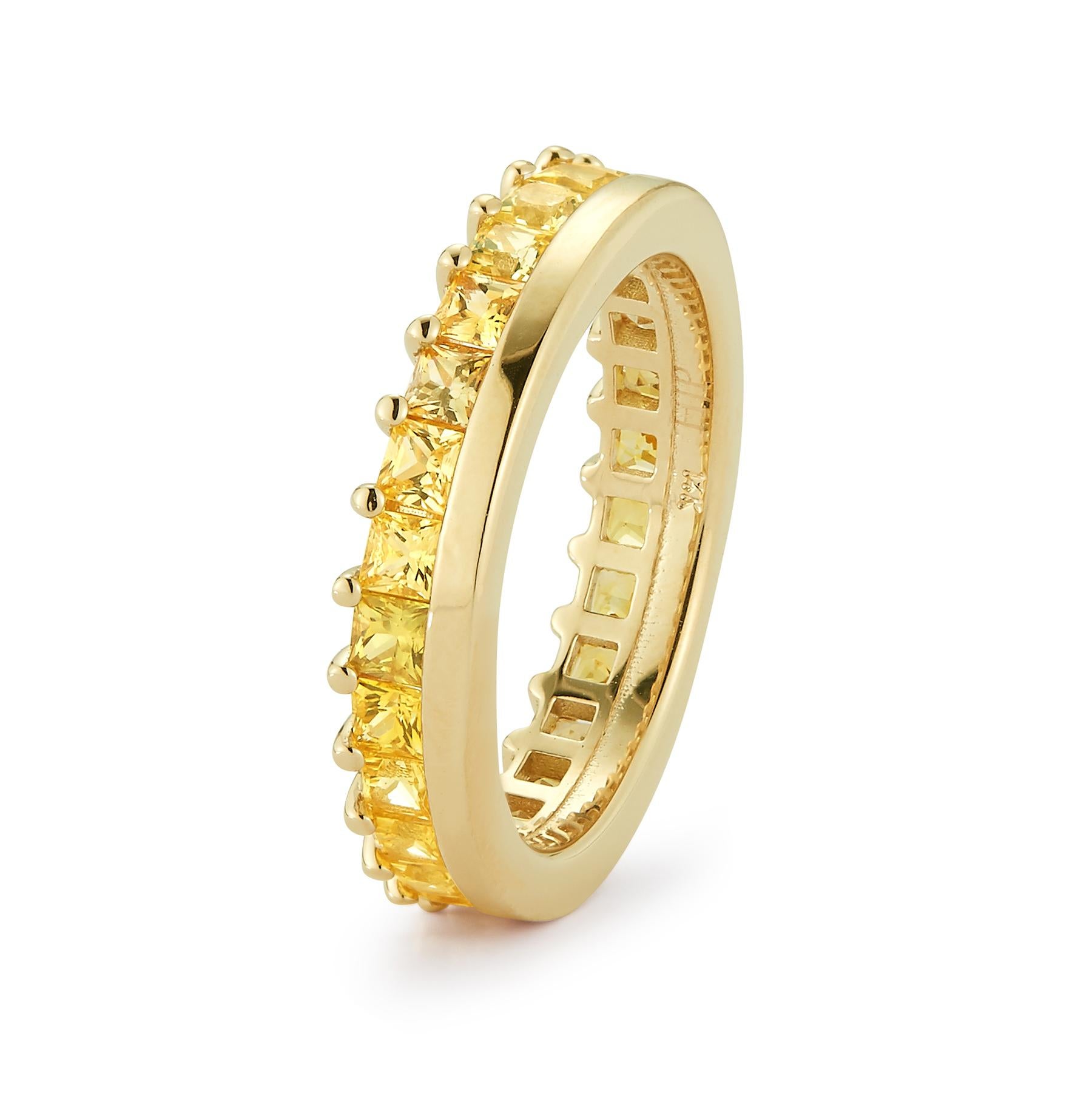 A continuous engagement or wedding eternity ring band set with 26 pieces of princess cut yellow sapphire stones. Inspired by the undefeated Mongolian warrior princess 
