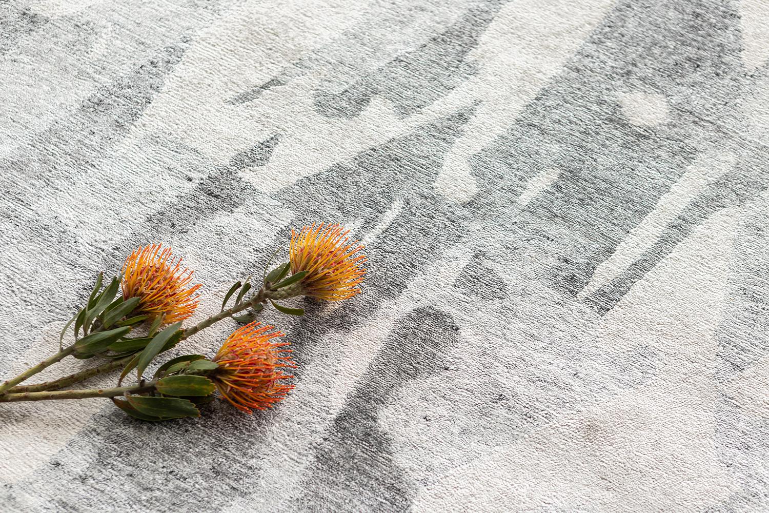 Luminous gray hues and rich waves of Abrash create an endless fascinating effect in this 'Hibagon’ rug in Yokai collection. The cool grayish colorway features some natural gradations of a broken mirror illusion. With its simplicity and mesmerizing