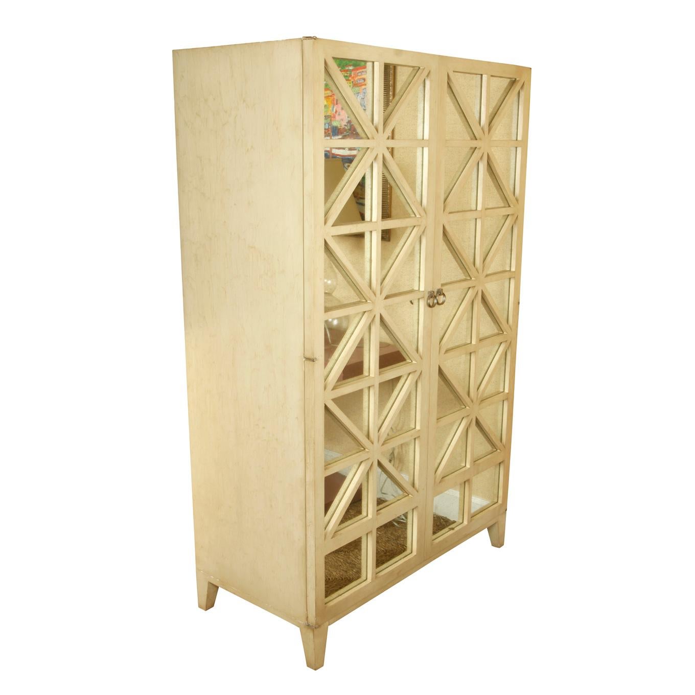 Hickory Chair cabinet with ivory painted wood and mirrored front, perfect as a bar or entertainment unit. Ivory wood and mirror create beautiful bias lattice design to front of cabinet.